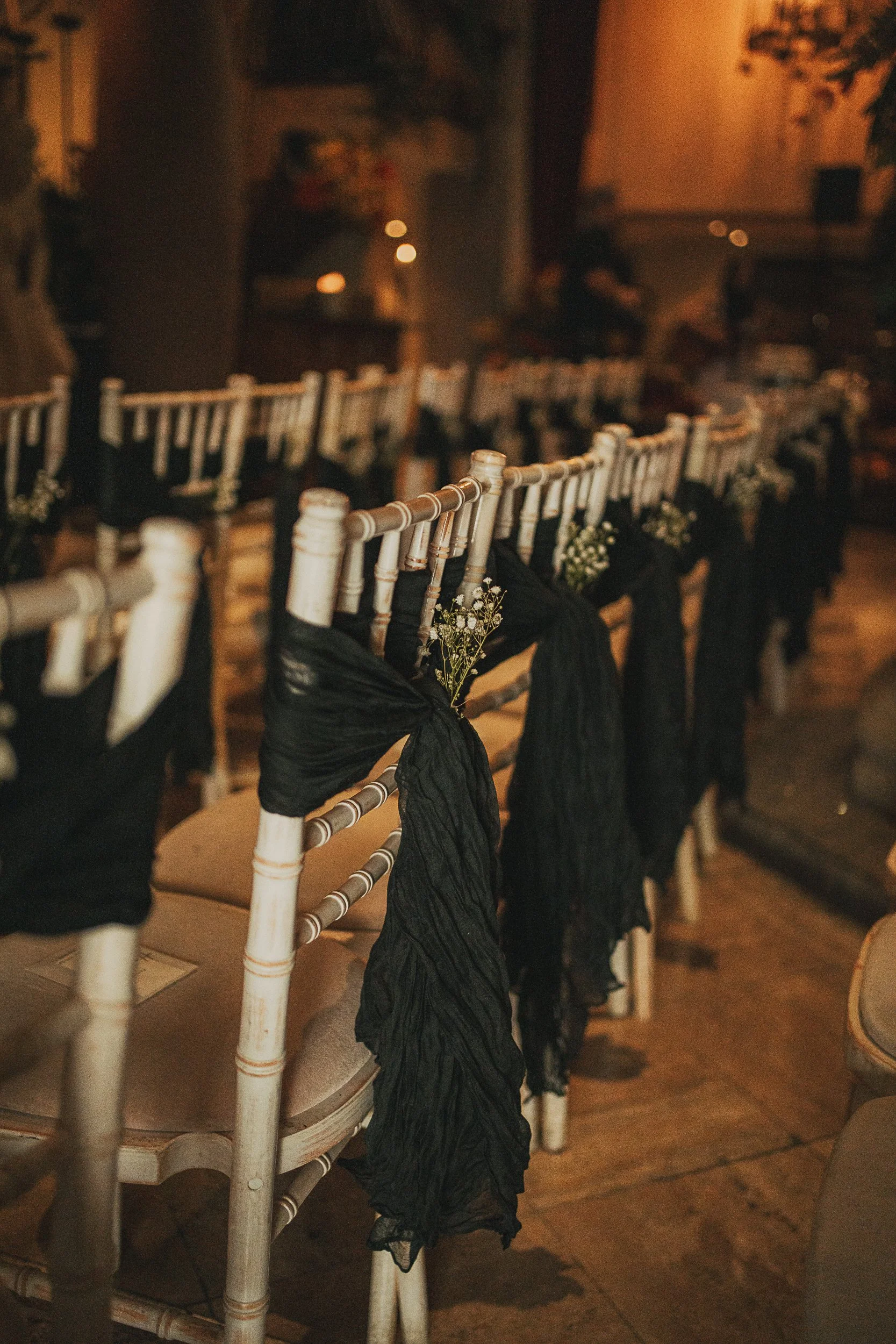 Arta Glasgow wedding ceremony setup with Chiavari chairs black bows and gypsophila aisle decor