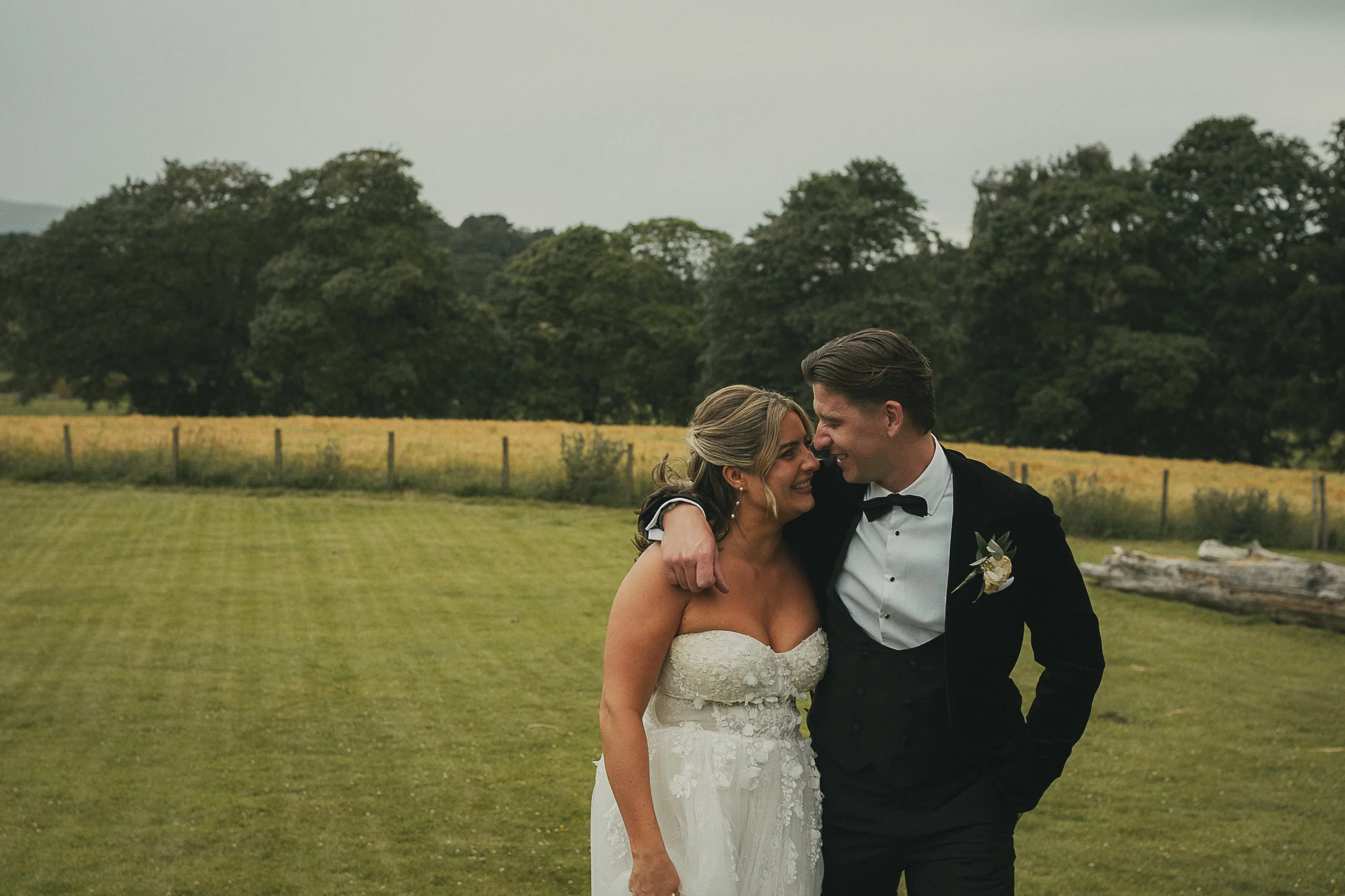 Emma and Frazer outside Cornhill Castle during their elegant Scottish wedding in the castle grounds.