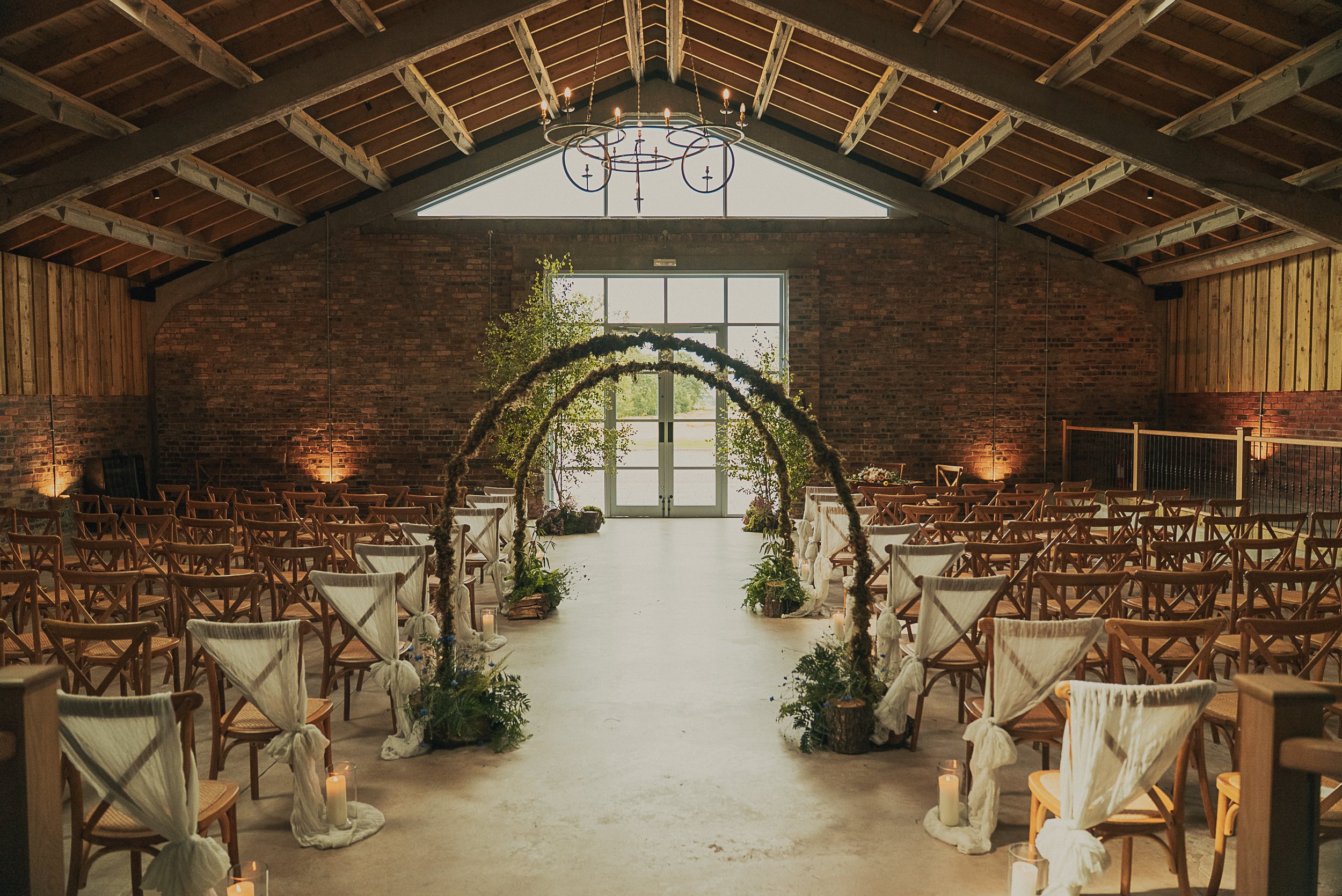 Beautiful outdoor wedding ceremony setup at Rossie on the Earn with wildflower arrangements
