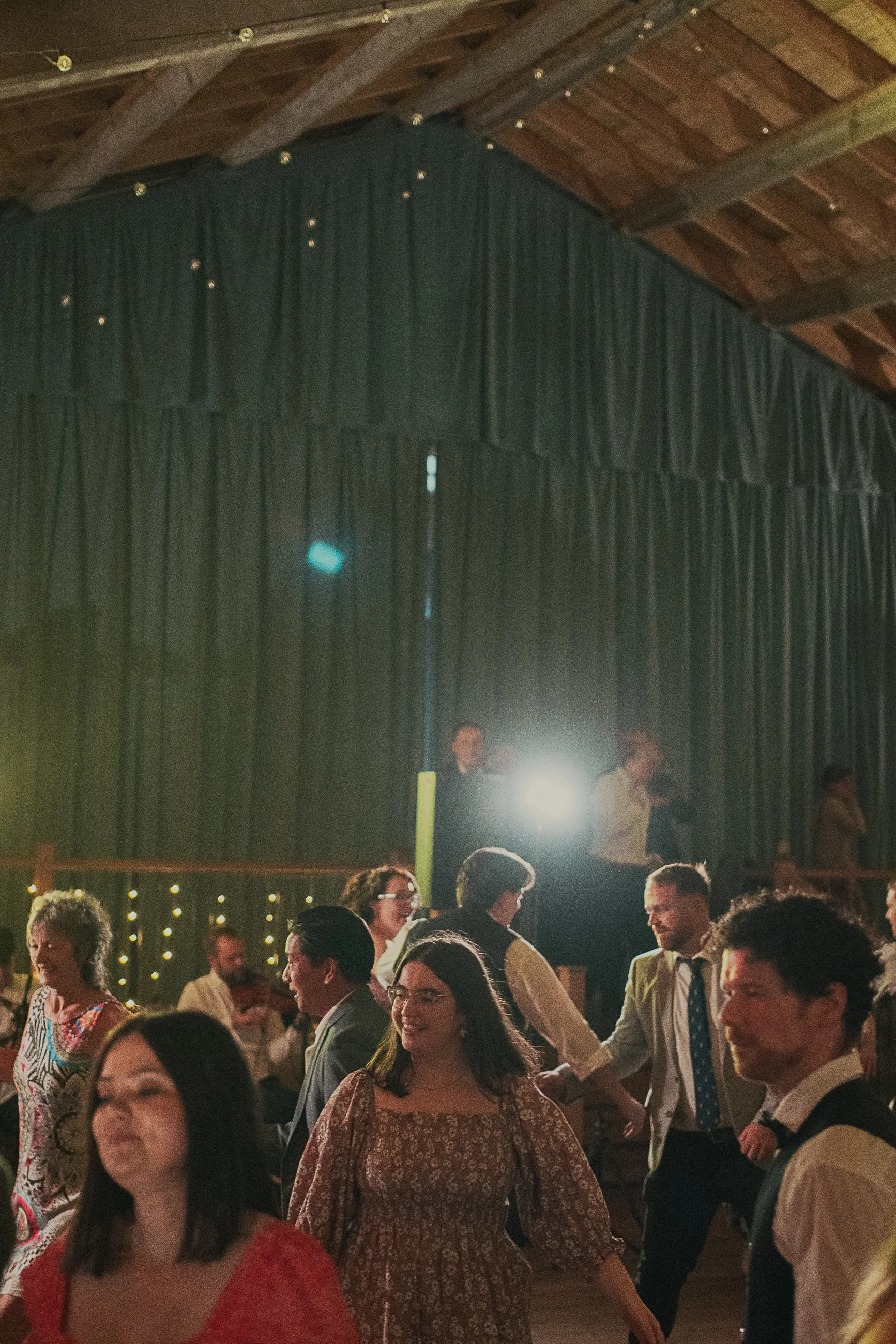 Wedding guests dancing during the evening ceilidh at Rossie on the Earn
