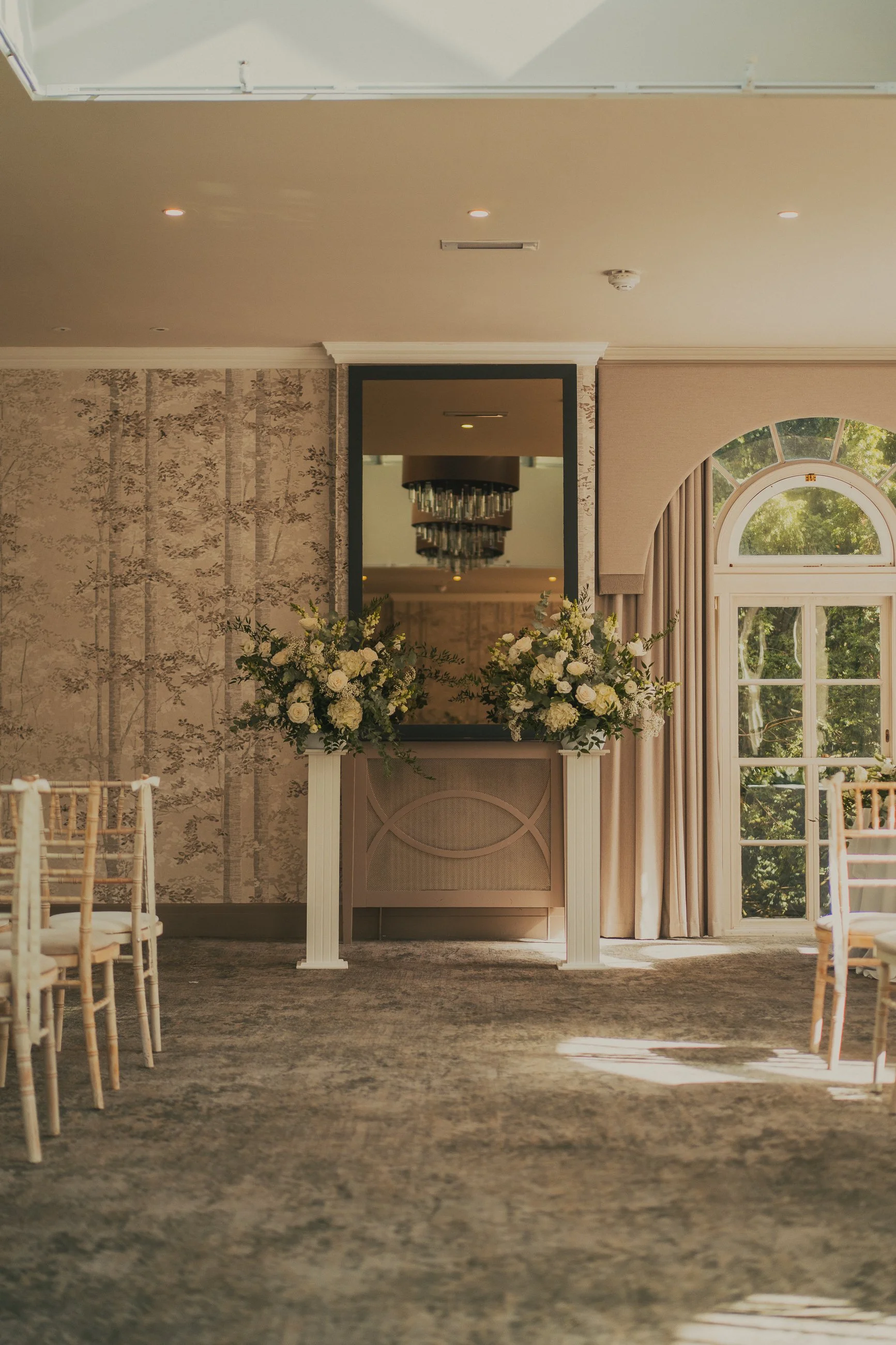 Floral aisle pedestals decorating the ceremony at Balbirnie House