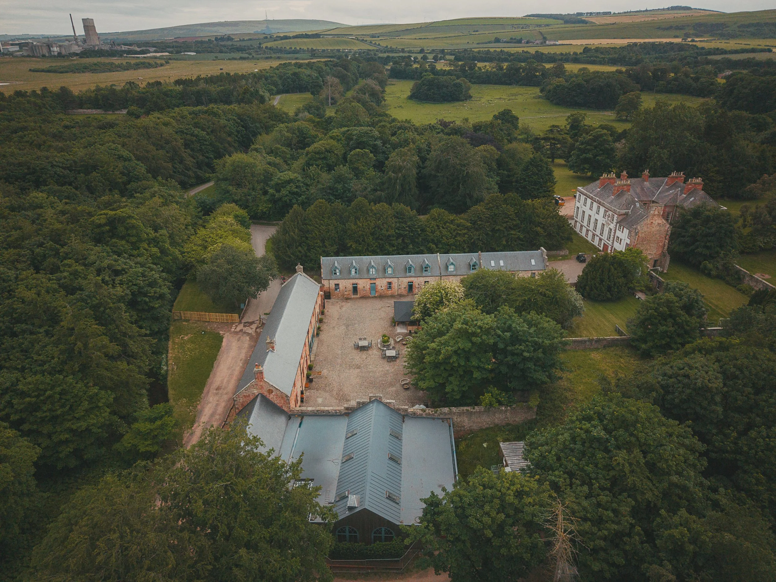 Drone shot giving aerial view of Broxmouth Courtyard Wedding Venue.