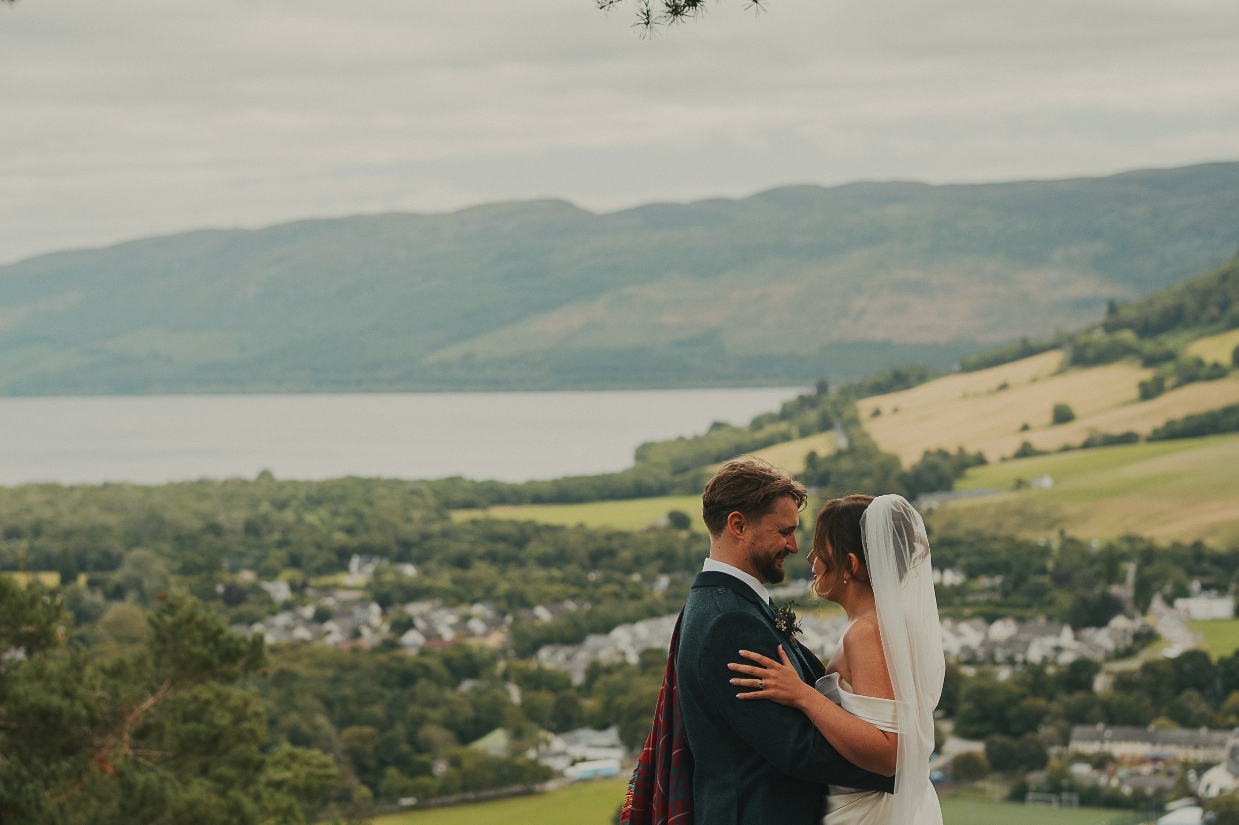 Becca and Joe together with a spectacular Scottish Highlands view during their Craigmonie Hill wedding