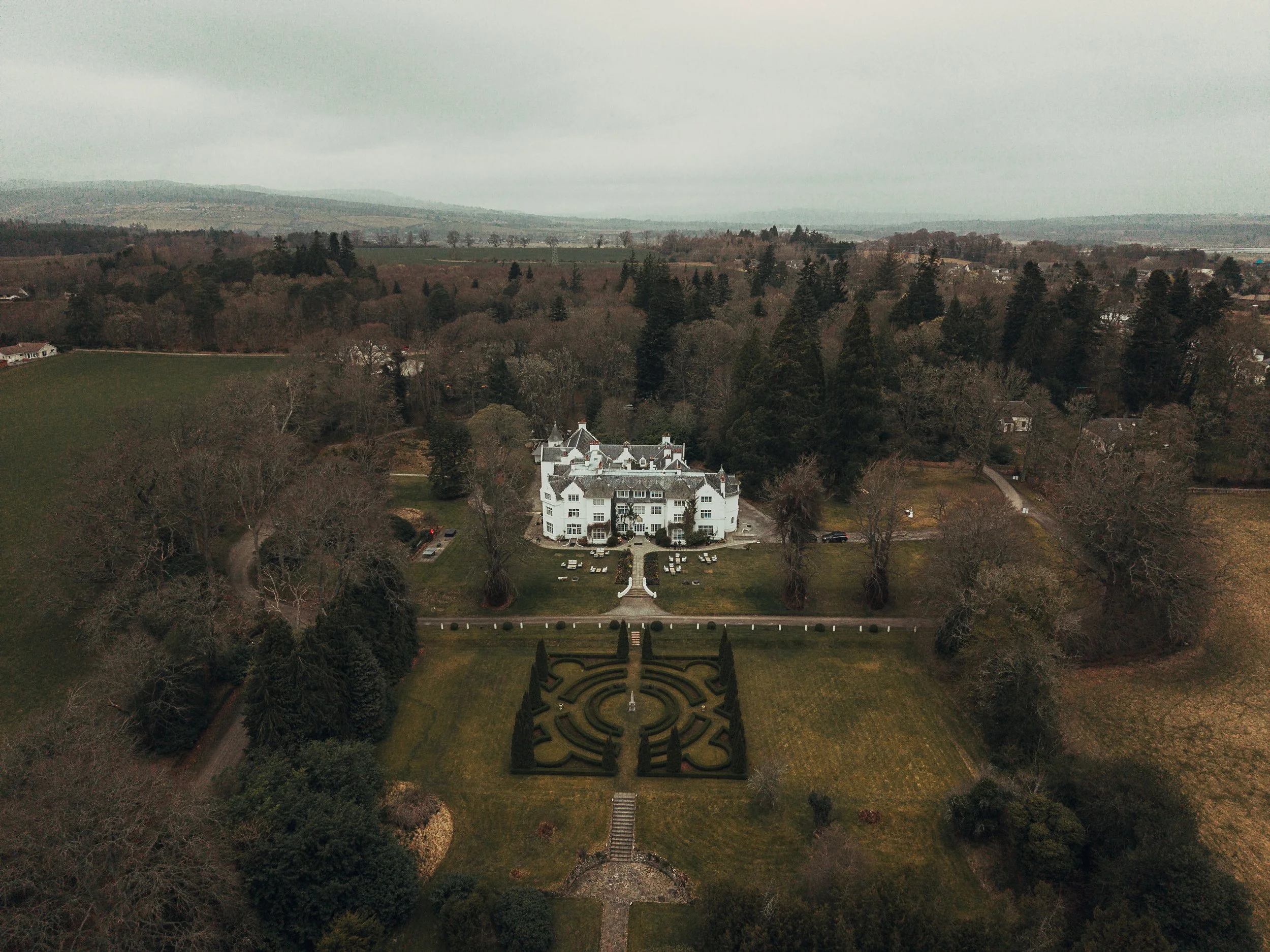Wide aerial view of Achnagairn Estate and surrounding Scottish Highlands countryside