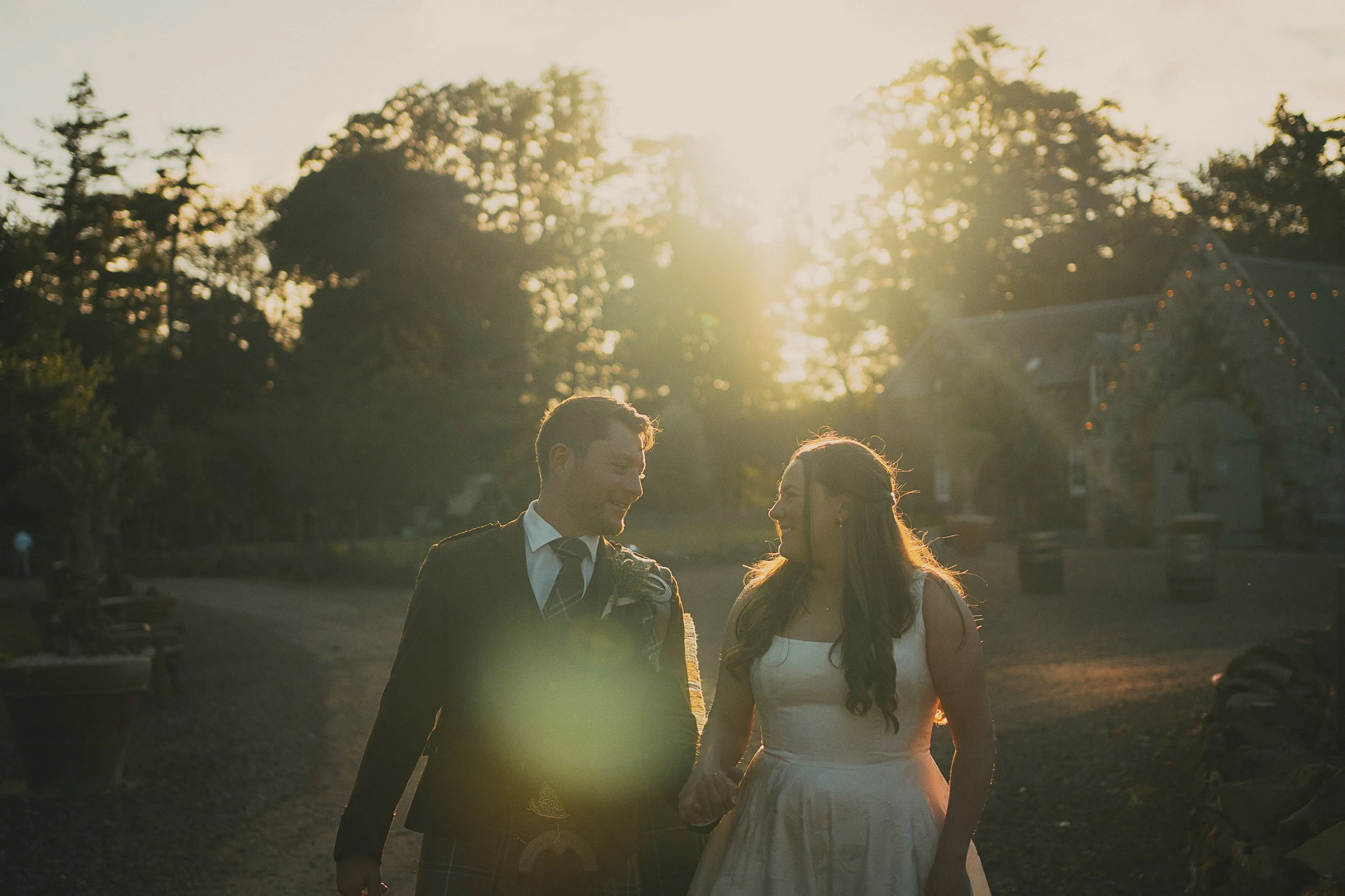 Golden hour wedding portraits of Emily and Peter in the grounds of Wedderlie House in the Scottish Borders.