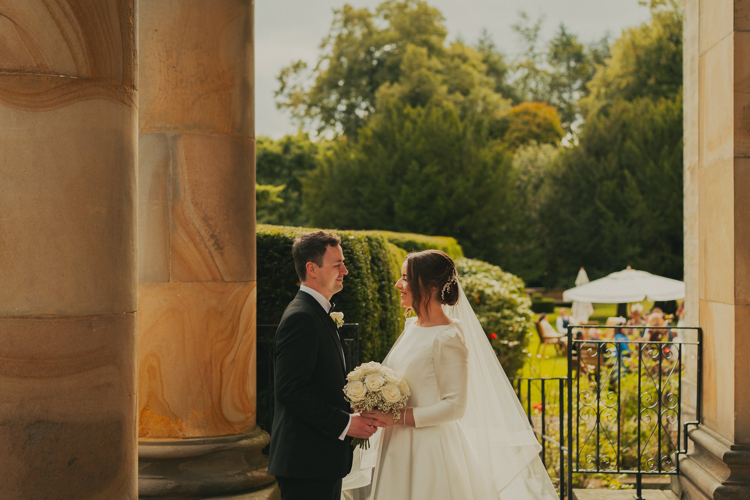 Alyssa and Ian at the front of Balbirnie House during their Scottish wedding