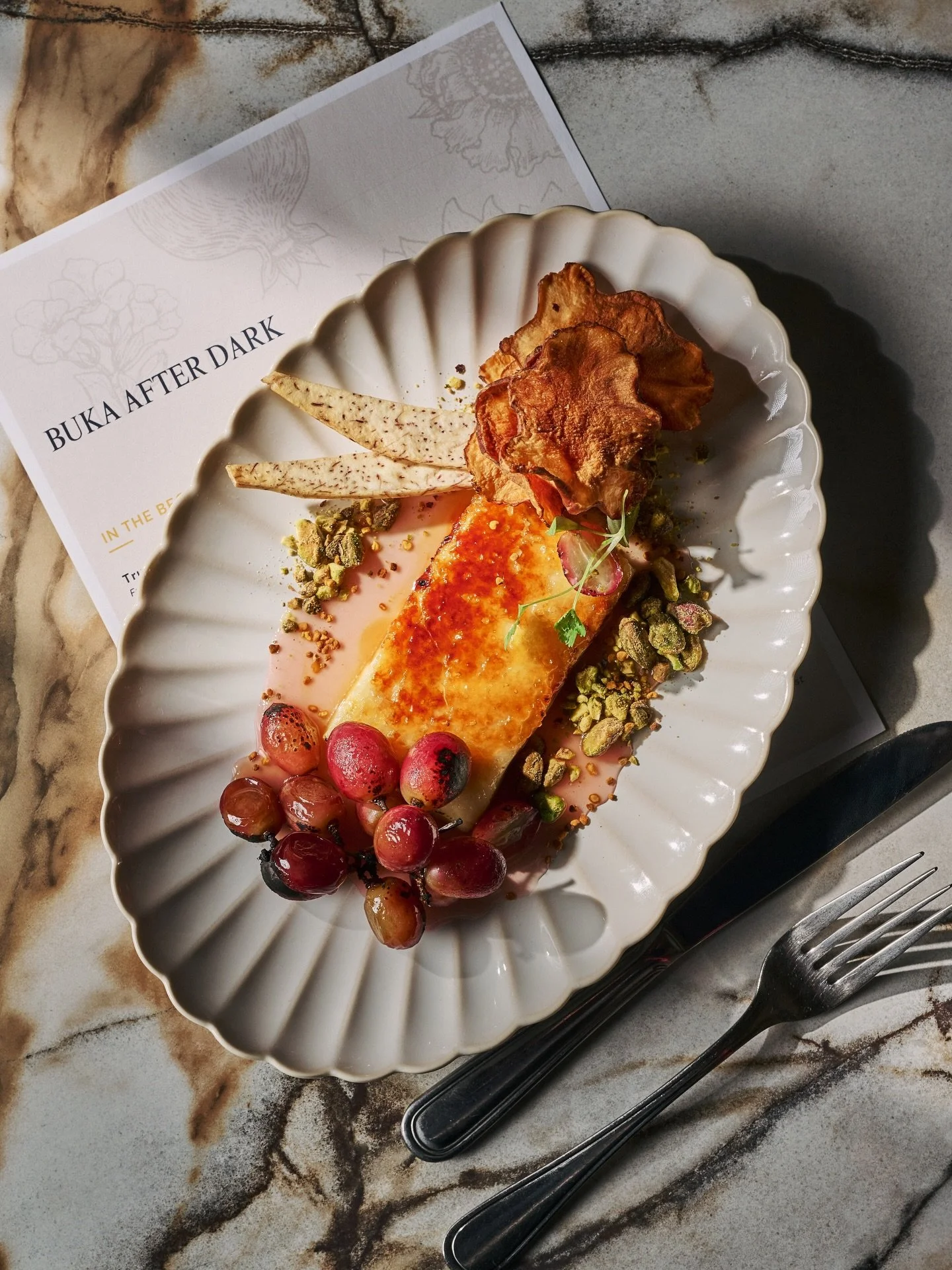 Br&ucirc;l&eacute;ed halloumi with concord grape.

Caramelized harmonies. Jammy sweetness. Salty perfection.
It&rsquo;s giving golden hour on a plate 😍🍇✨

Join us for dinner at Buka After Dark tonight ✨

Reserve your table &mdash; this one deserves