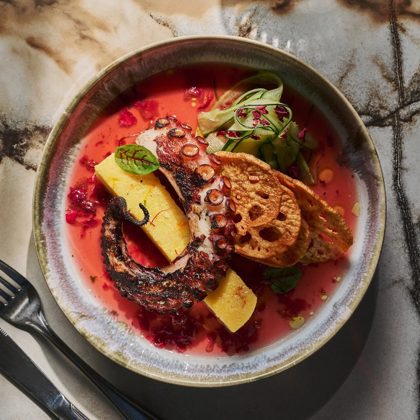 Under the sea 🌊 way above your expectations 🐙✨

Delicately grilled octopus sits on a bed of saffron polenta, calamansi citrus, cucumber &amp; rose petal tea and finished with lotus root 🍊🪷✨

Come dive in tonight 🏊🏻💕

#seafoodrestaurant #saugae