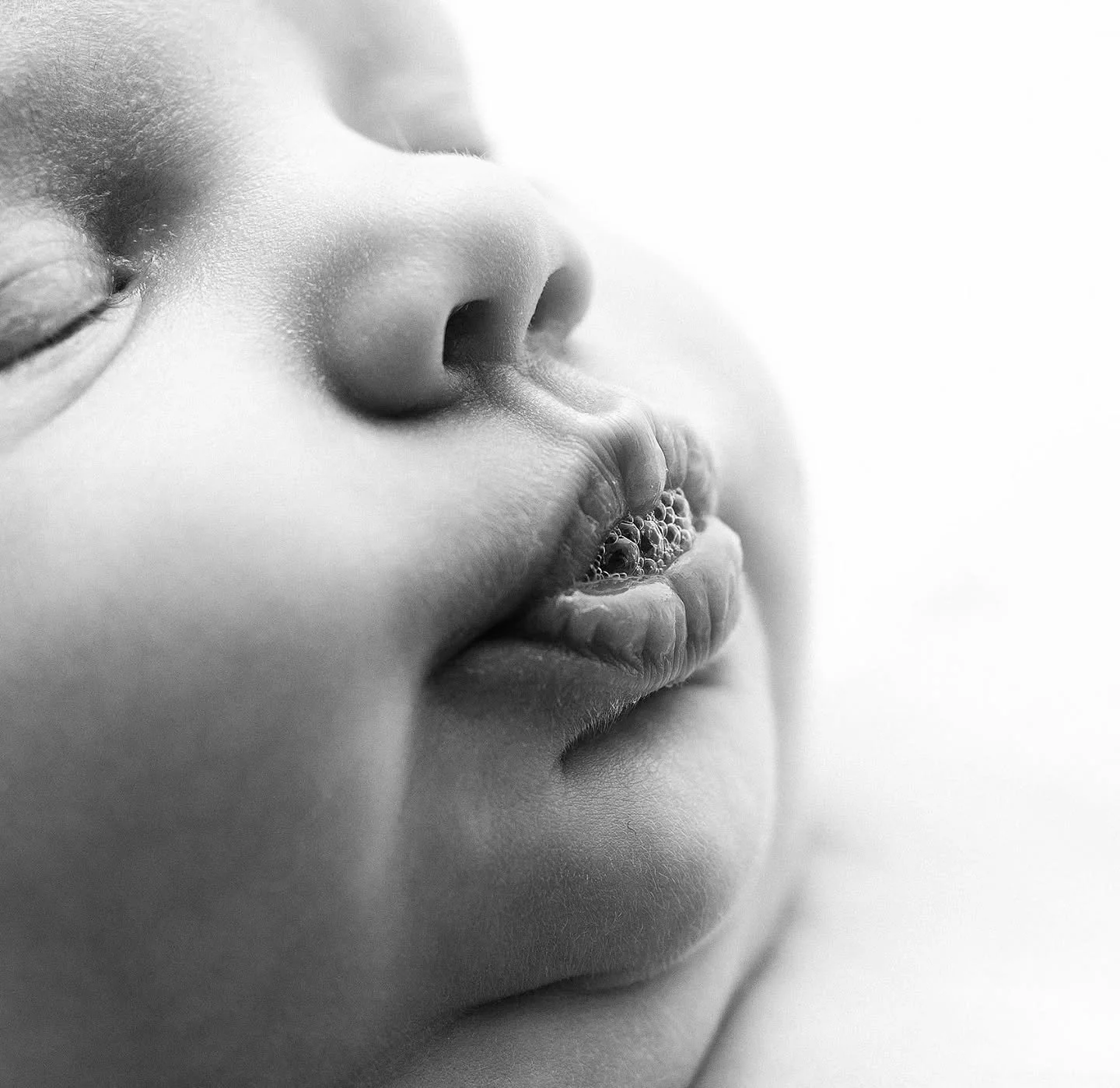 That adorable pout and those precious newborn bubbles! Capturing these fleeting details is such a joyful part of newborn photography because, years from now, it&rsquo;s these wonderful moments that you&rsquo;ll cherish and want to remember just as th