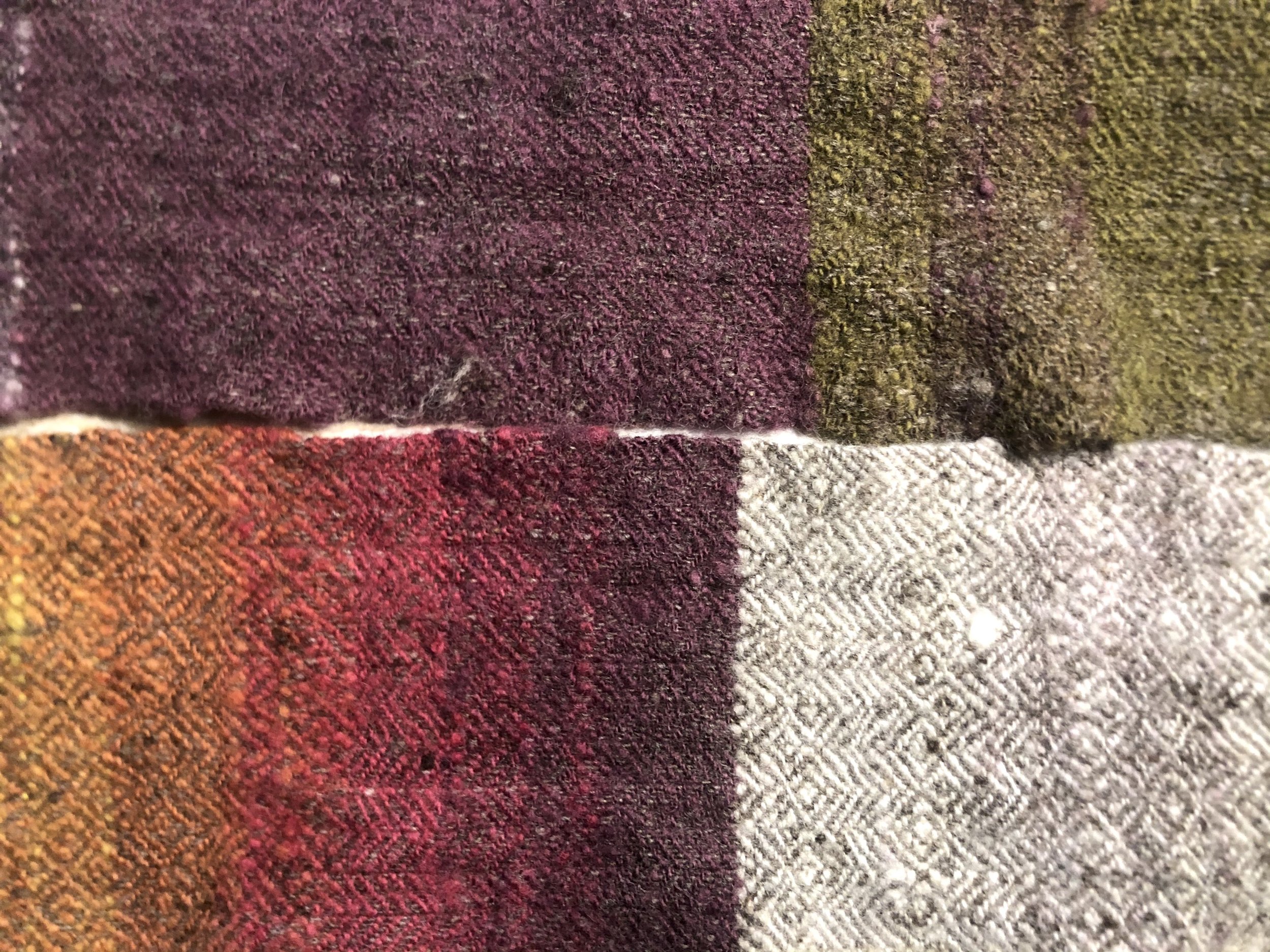  Handspun, hand dyed, and handwoven wool samples, 2021. Dyed with yellow plants, cochineal, and iron. My first entirely handspun wool fabric. 