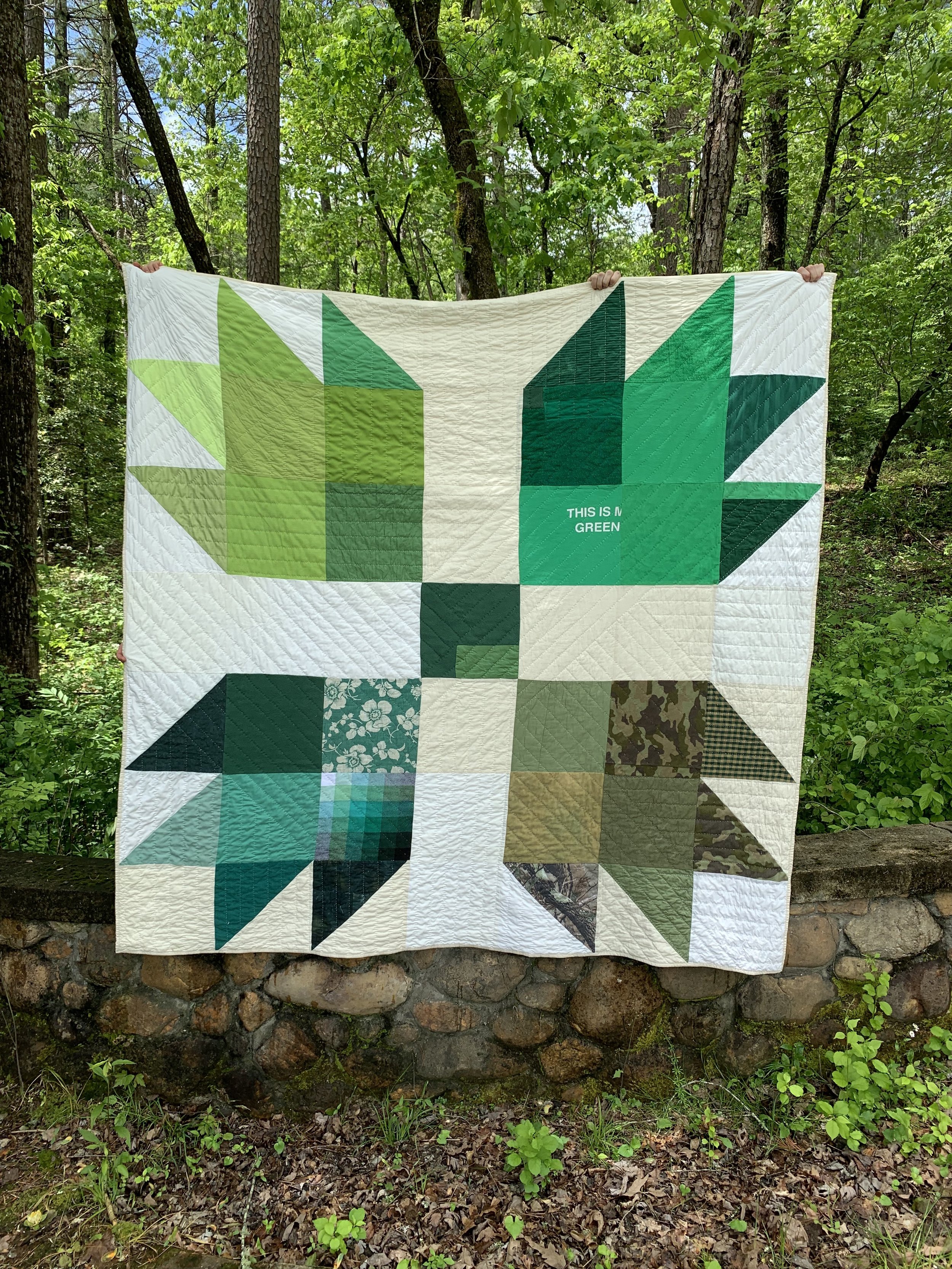   This Is My Only Green Quilt , 2023. Various fabrics (including handwoven cotton, denim, terry cloth, knits, and velveteen), cotton batting, and muslin. 80” x 80”. Based on a Bear Claw / Bear Claw quilt block and created during a workshop with  Coul