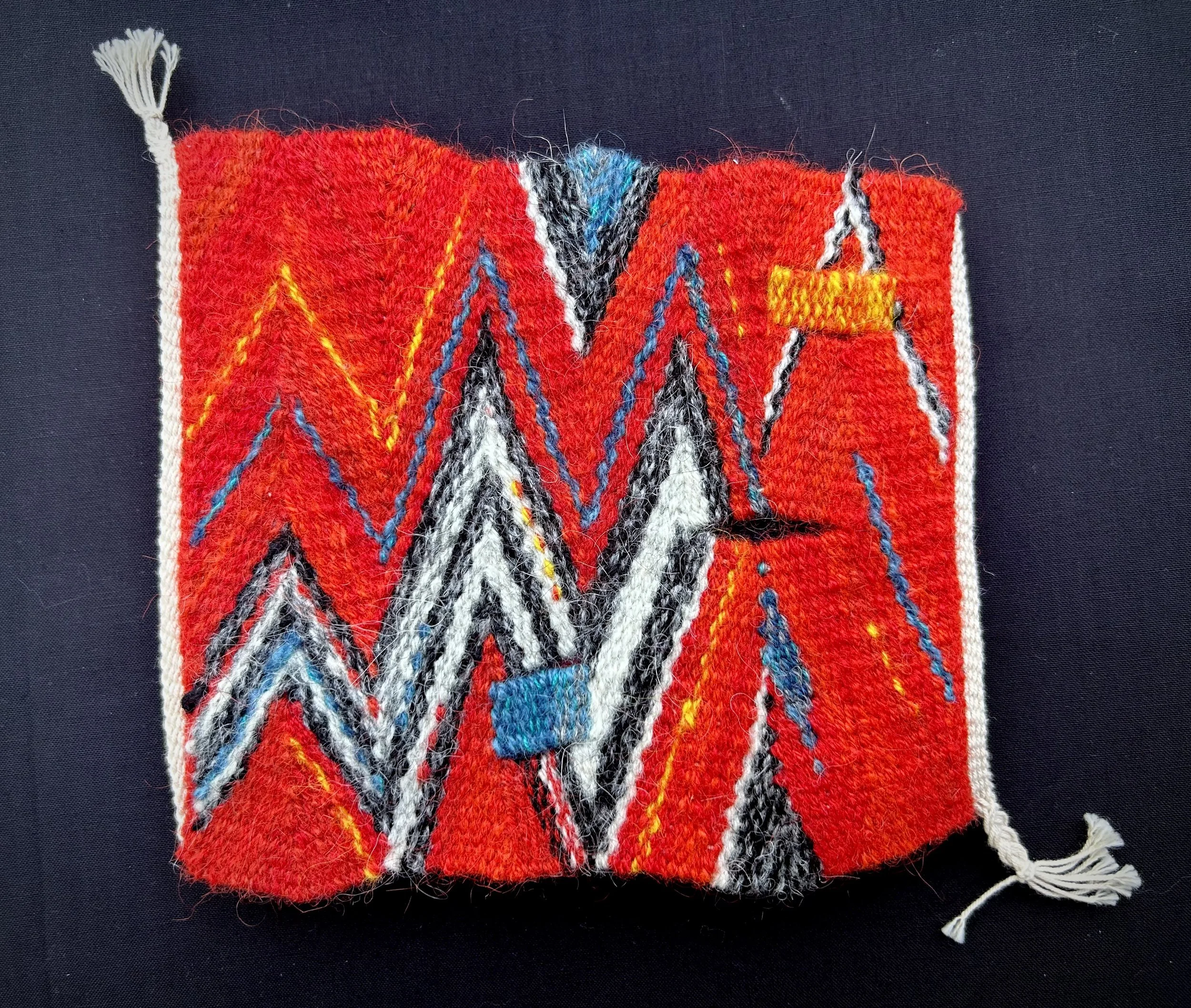   Keystone , 2021. Cotton warp and wool weft. 6.25” x 6.75”. Woven using eccentric weft techniques. 
