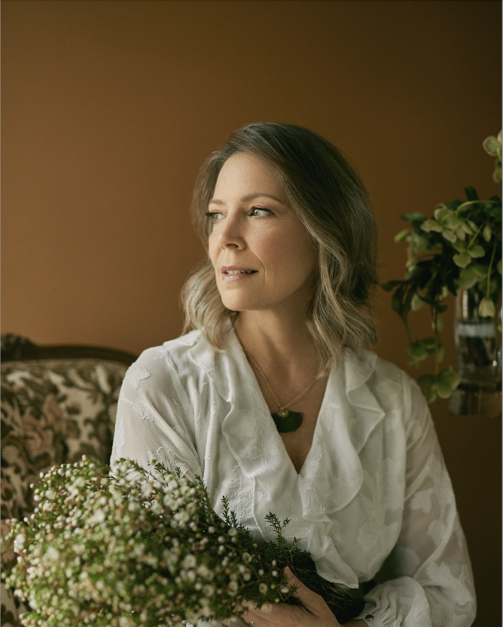 Tammie holding a bunch of flowers