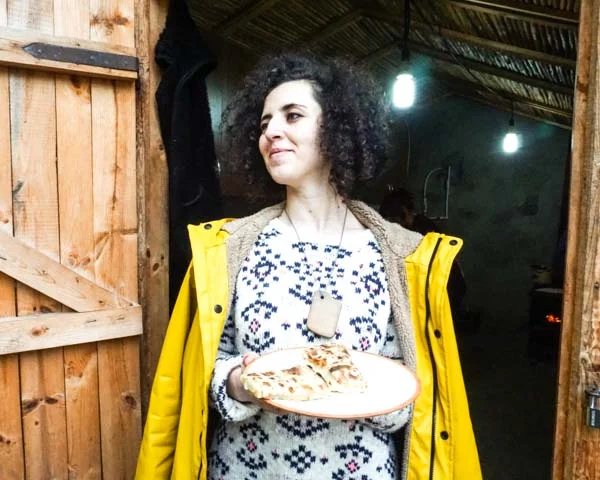 Saten G , another one of our Tumo student friends, is holding our sweet version of jingalov hats in a small village in Artsakh. Eating here was like eating in an alpine cabin.