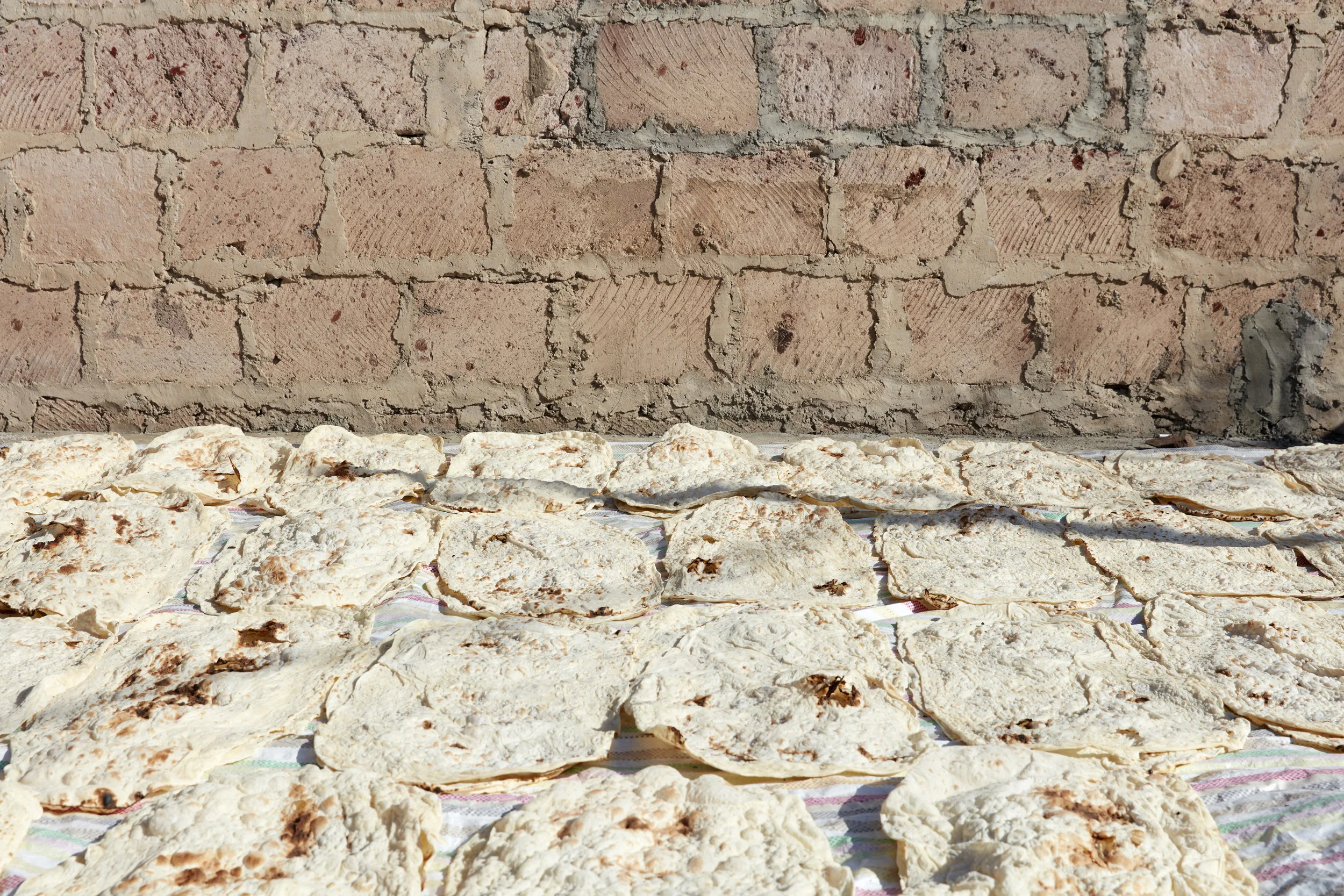 It's traditional to bake lavash in the fall to eat all winter long. At the home we visited in Yeghvard, the floors and roof were lined with lavash. Once dried, it was stacked and stored in a spare bedroom.