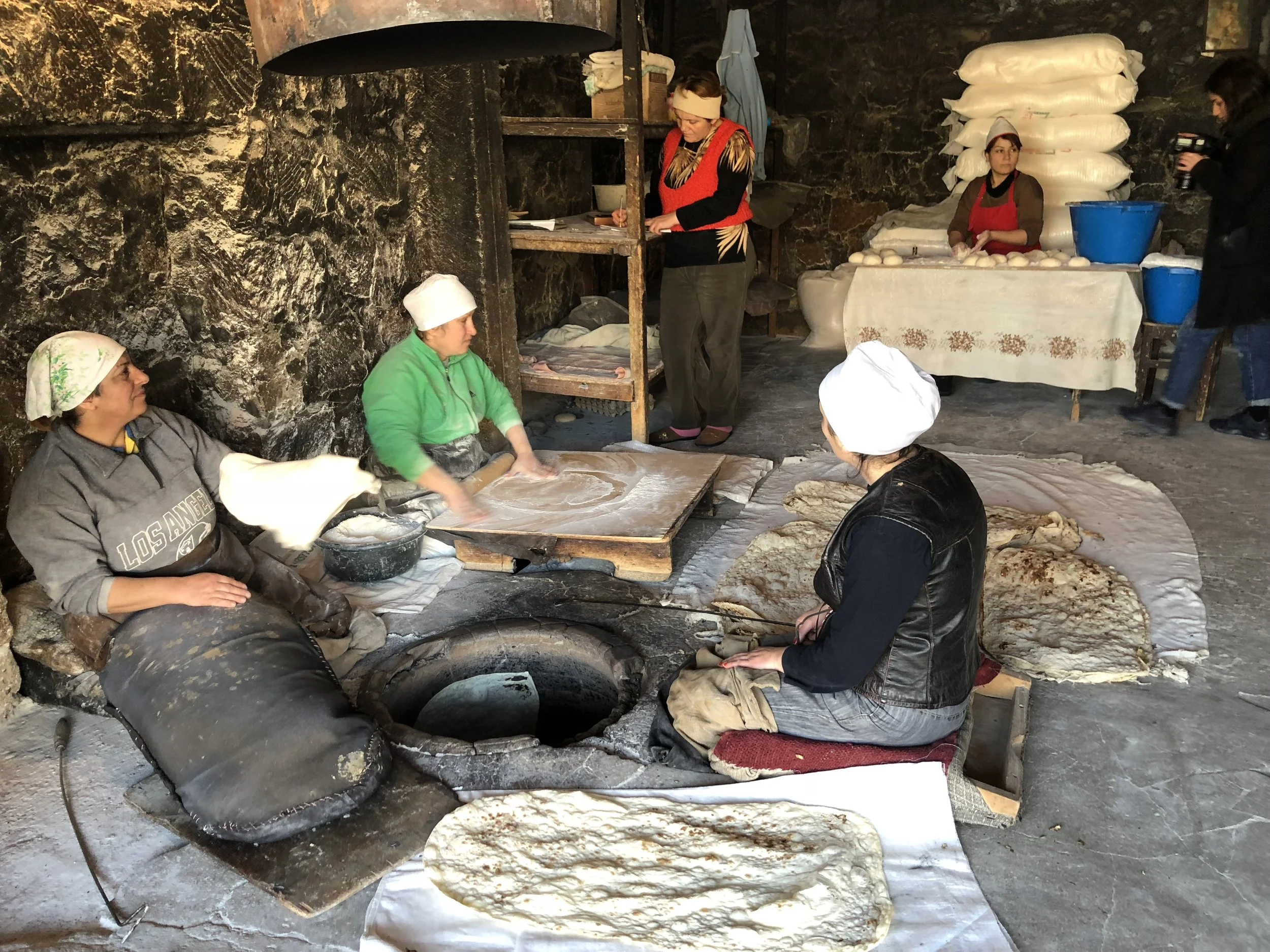 In Argel, four women are needed to mix, roll, bake, and cool the lavash. A fifth woman minds the till, counting change with an abacus when customers bought lavash