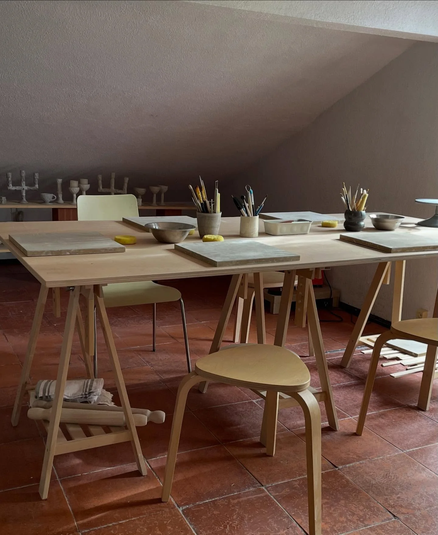 A few recently shots from my camera roll: 

1. Studio ready to welcome students to the workshop.
2. Carving a few more candle holders. I love this stage of the clay.
3. Test tiles.
4. The Shell wall lamp I made for a friend (in her  beautiful house).