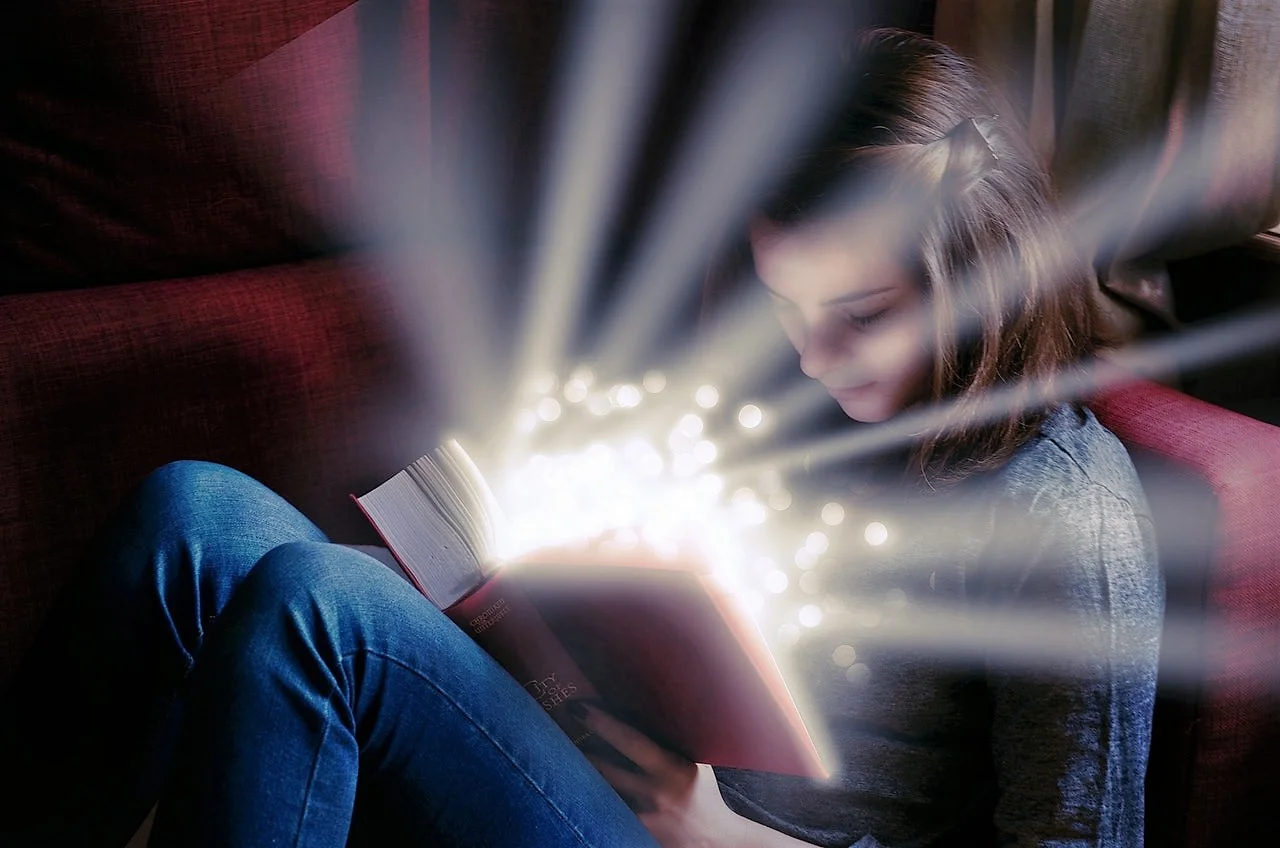 girl with luminous glow book.jpeg
