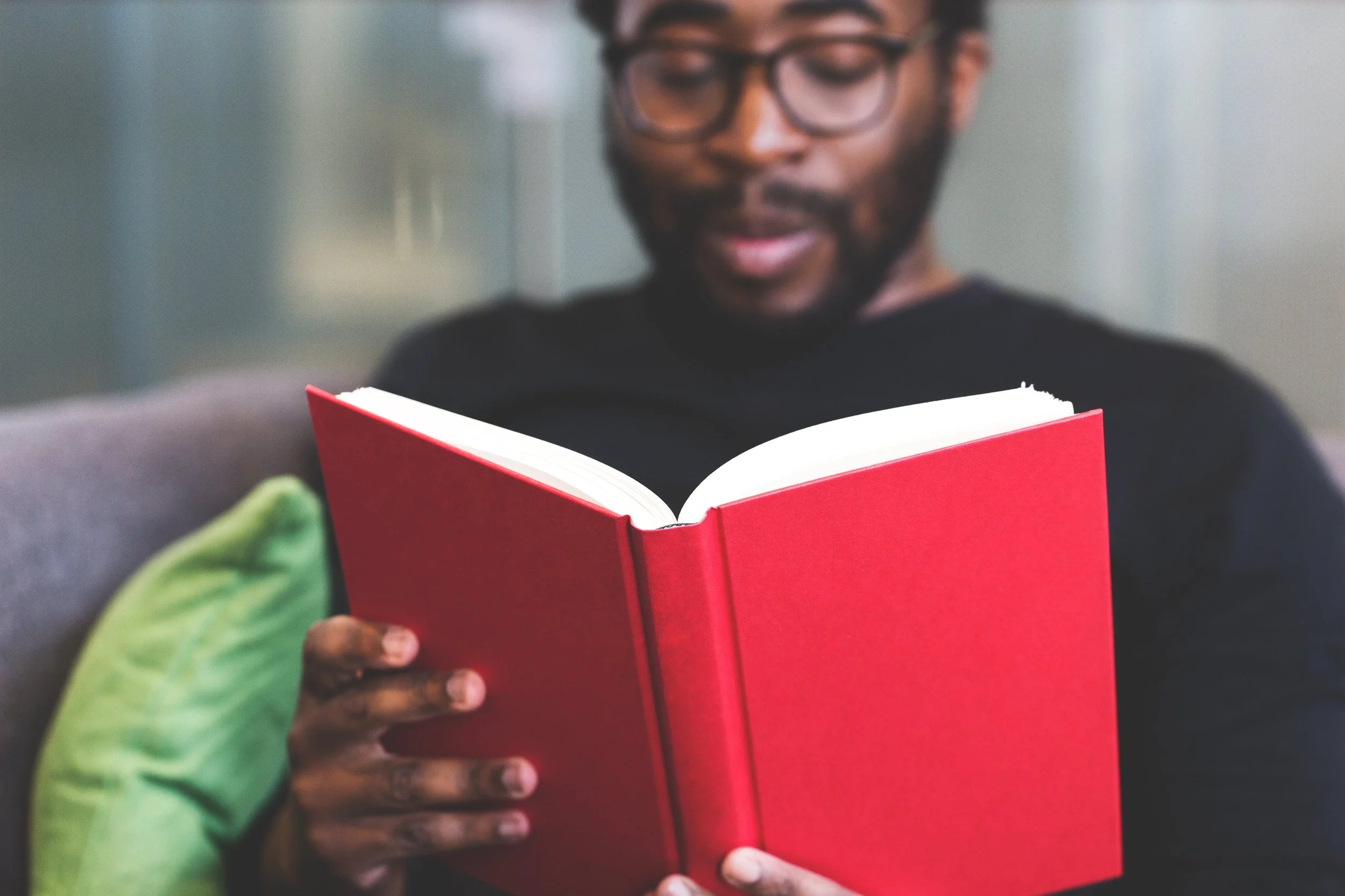 Black guy reading book Pexels.jpg
