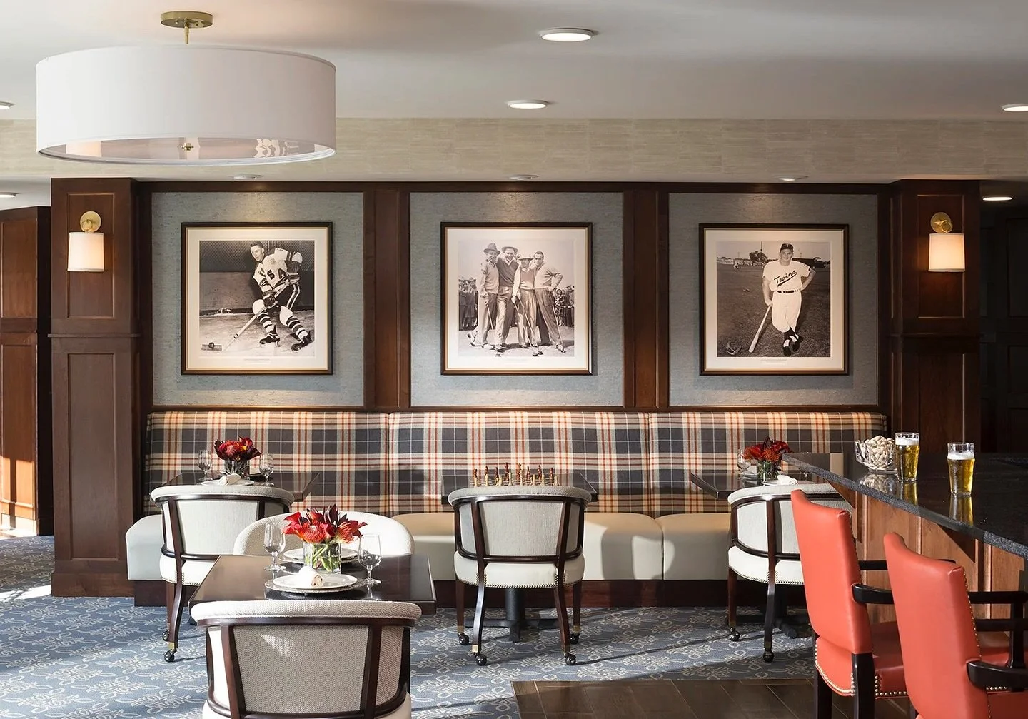 While residential design remains our main focus, we love highlighting the commercial projects we&rsquo;ve brought to life as well. This dining space showcases a timeless plaid that lends a masculine edge, balanced by refined seating and nostalgic art