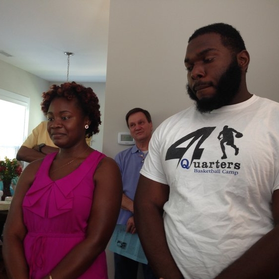JENNIFER JONES (WHO HAS FAMILY TIES TO WALLTOWN) & TJ HEARN (WHO GREW UP IN THE NEIGHBORHOOD) STAND DURING THE ALEXANDER HOUSE BLESSING ON AUGUST 16, 2014. THEY WERE TWO OF OUR FOUR INITIAL RESIDENTS.