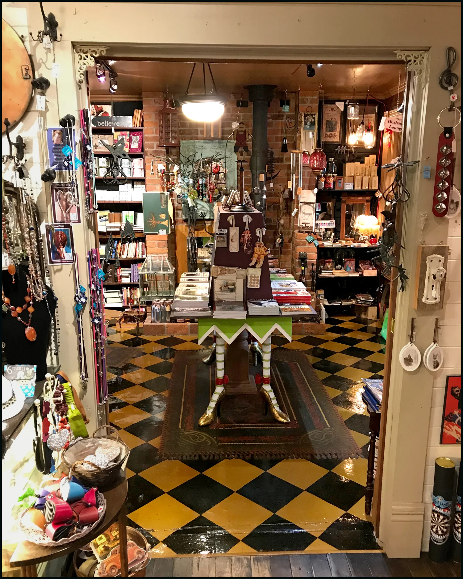 Looking into The Book & Music Room you can see the cement floor, hand-painted by Lillian to look like tiles and rugs.
