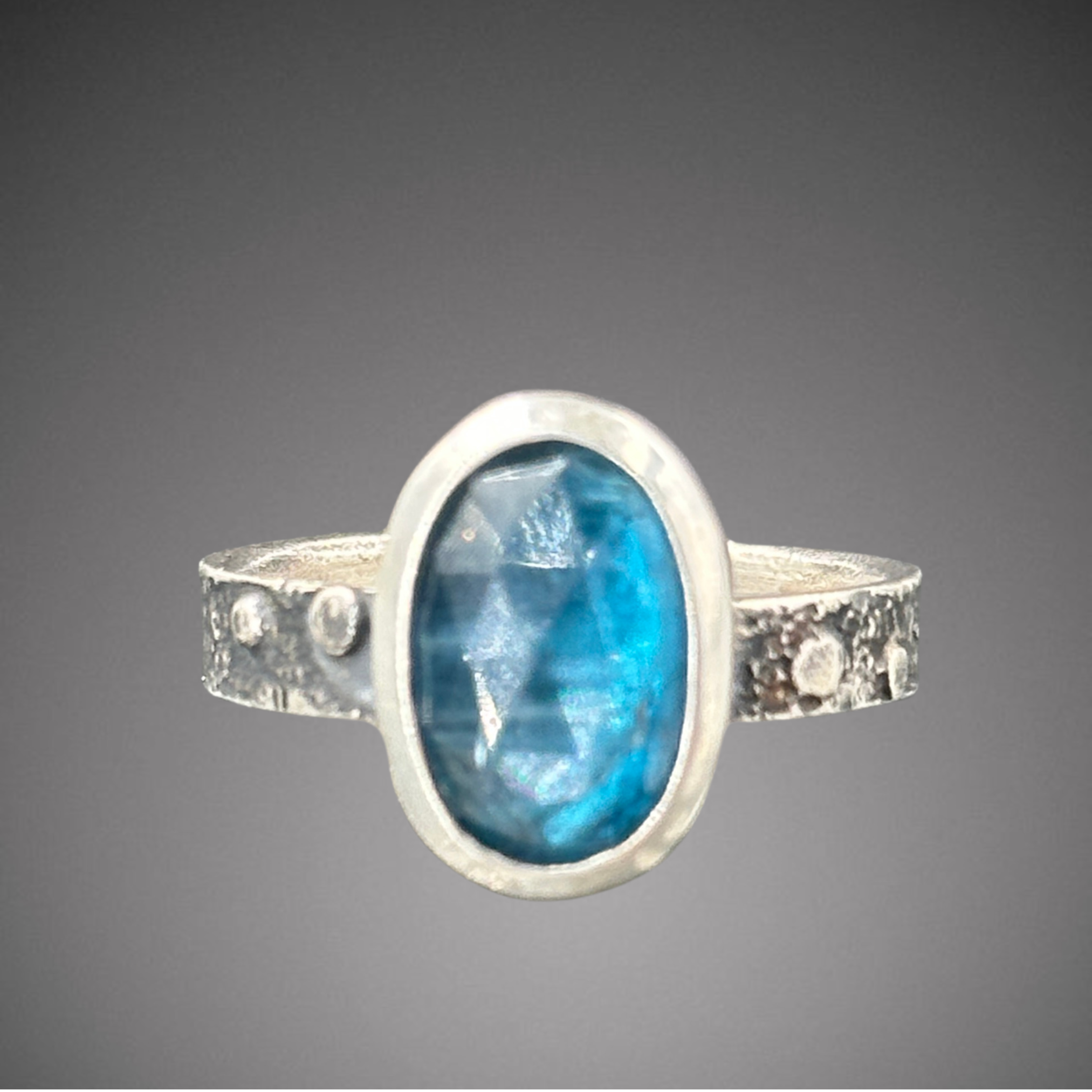 Teal Kyanite on pebble band size 9
