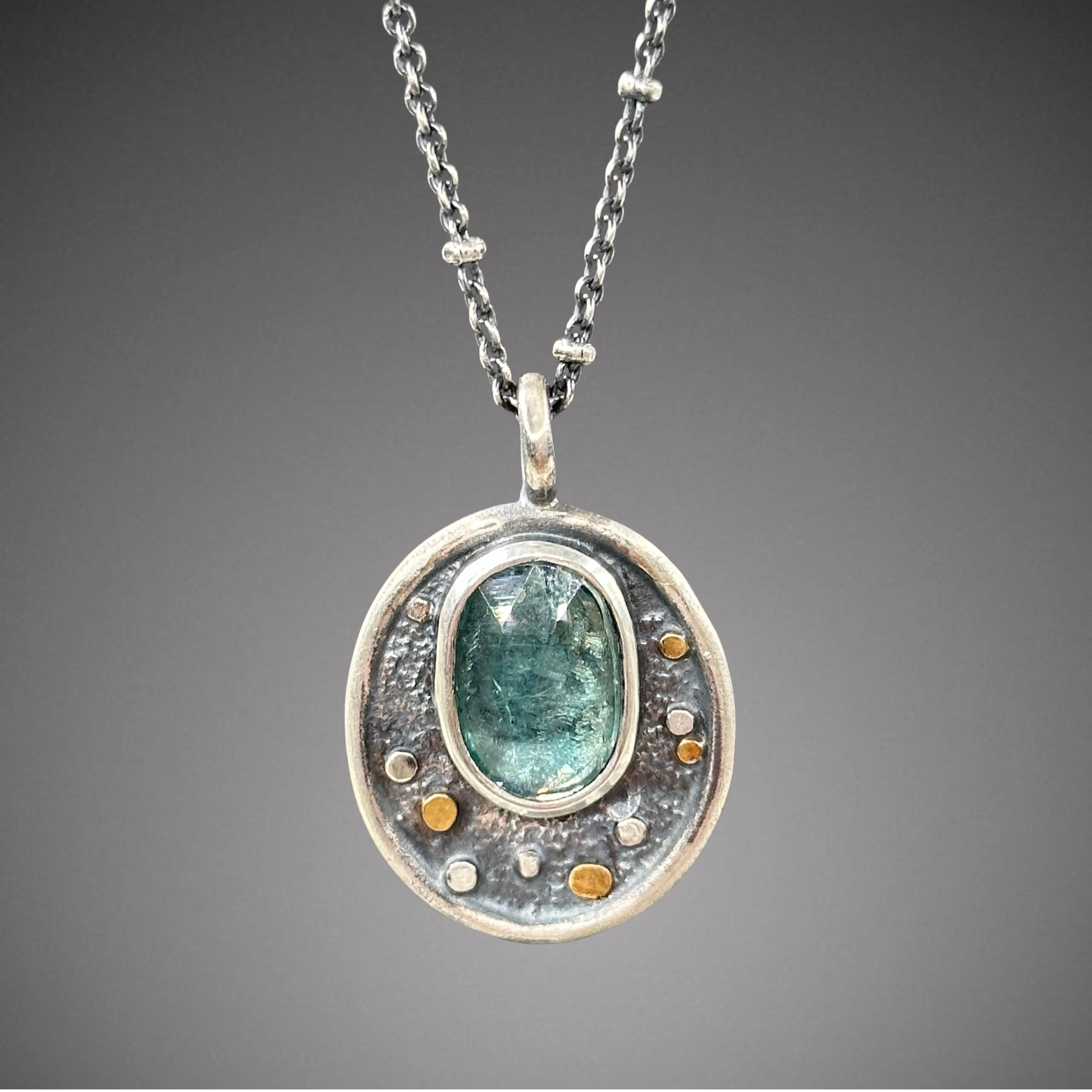 green kyanite pebble pendant.png