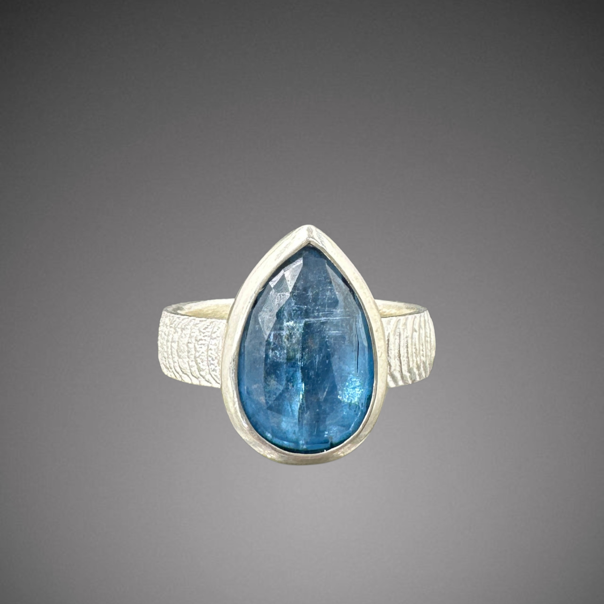 _pear kyanite on cuttlefish band .png