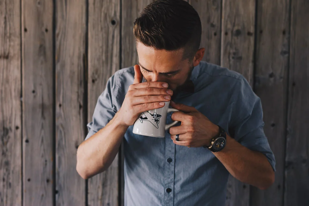 Barista smelling coffee for a taste test