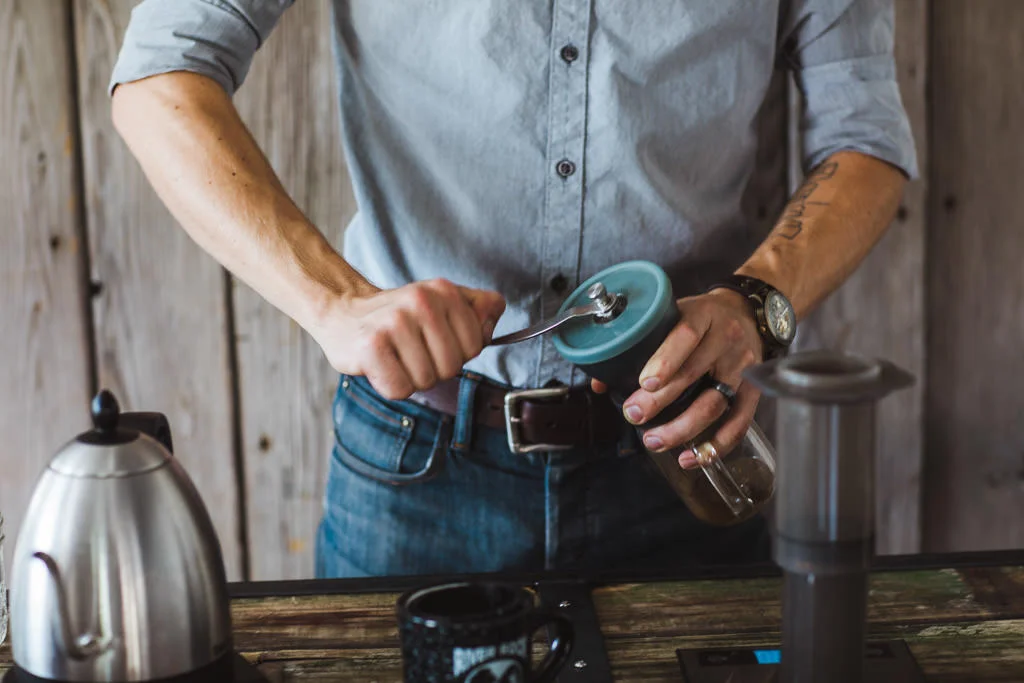 Grinding coffee on a Hario hand burr grinder