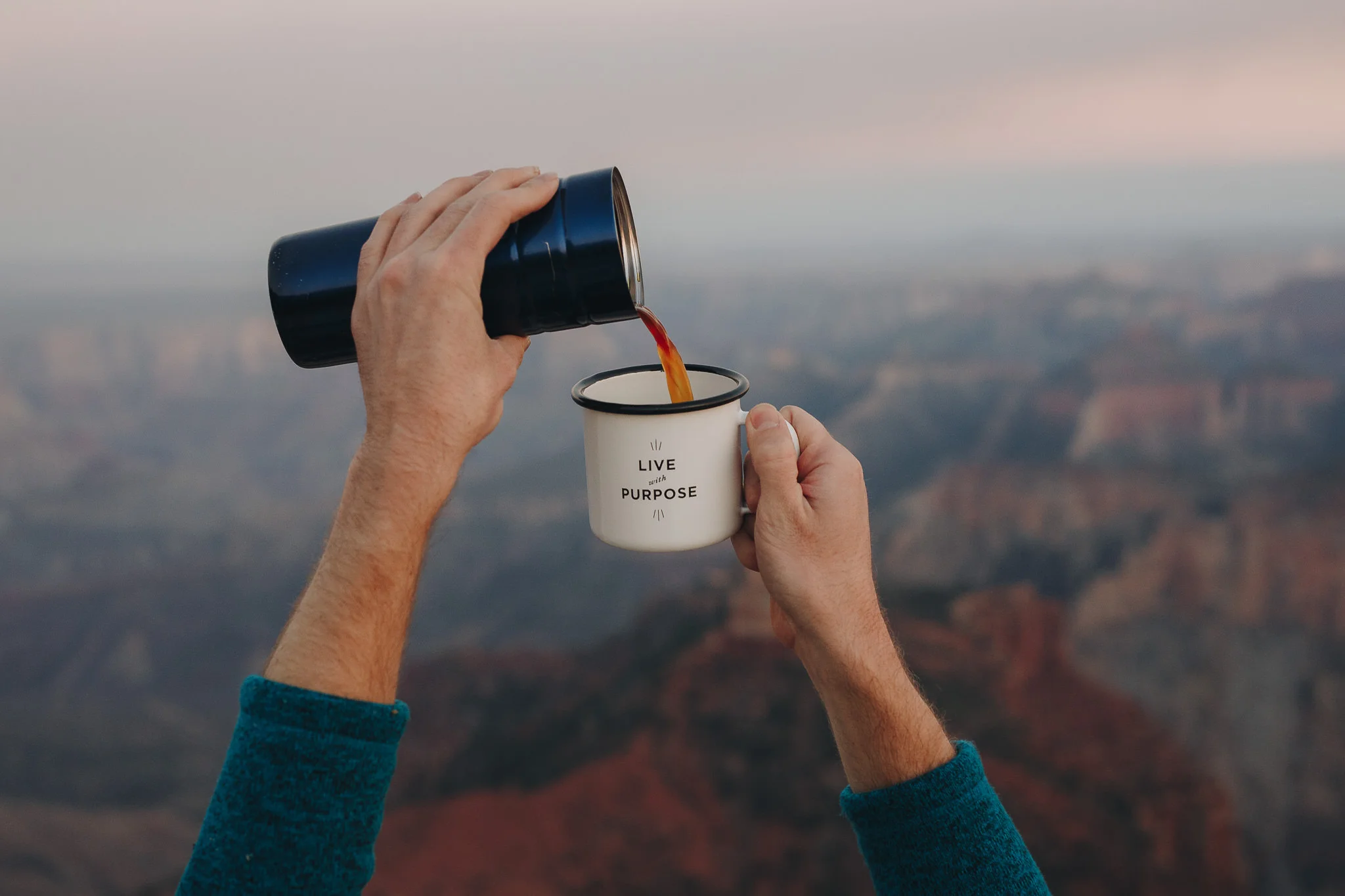 Pouring Aeropress coffee into Created Co mug