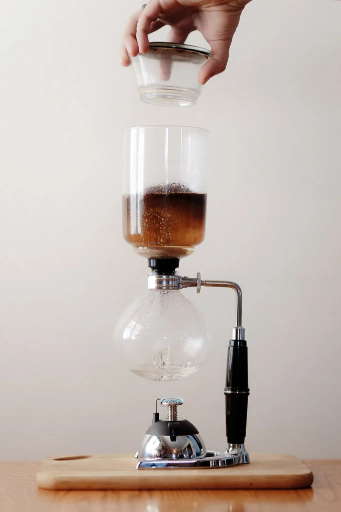 Add coffee to the upper vessel of the siphon