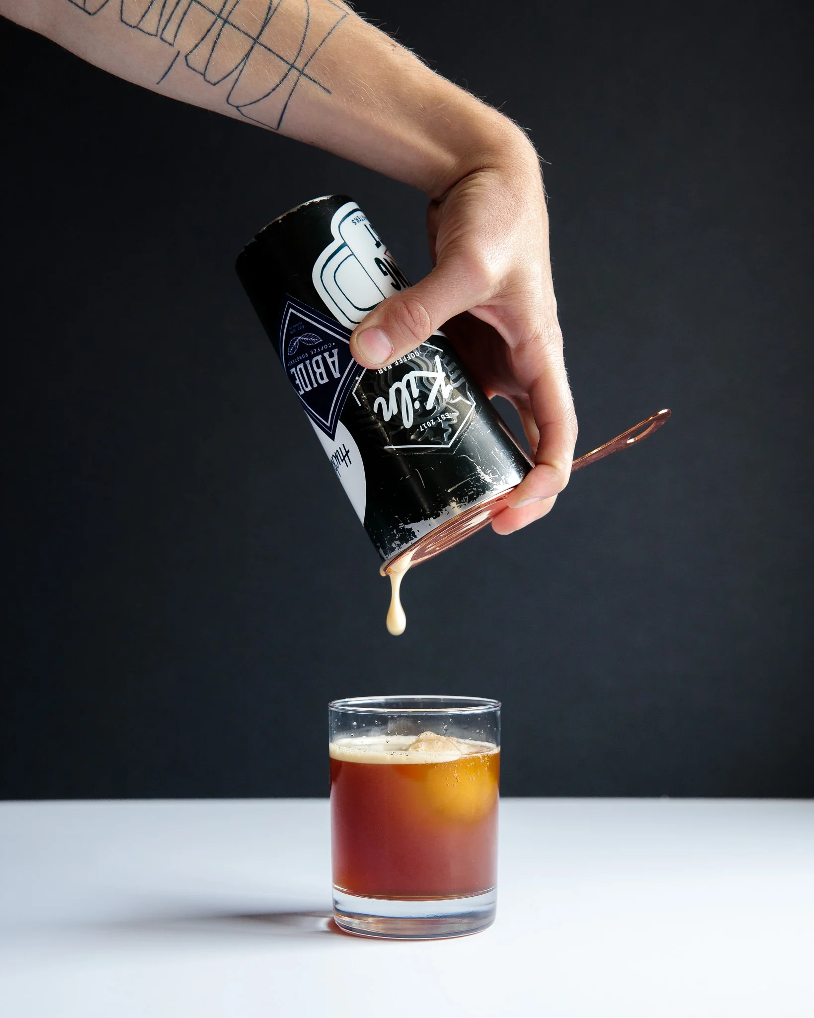 Aerate by shaking cold brew with ice