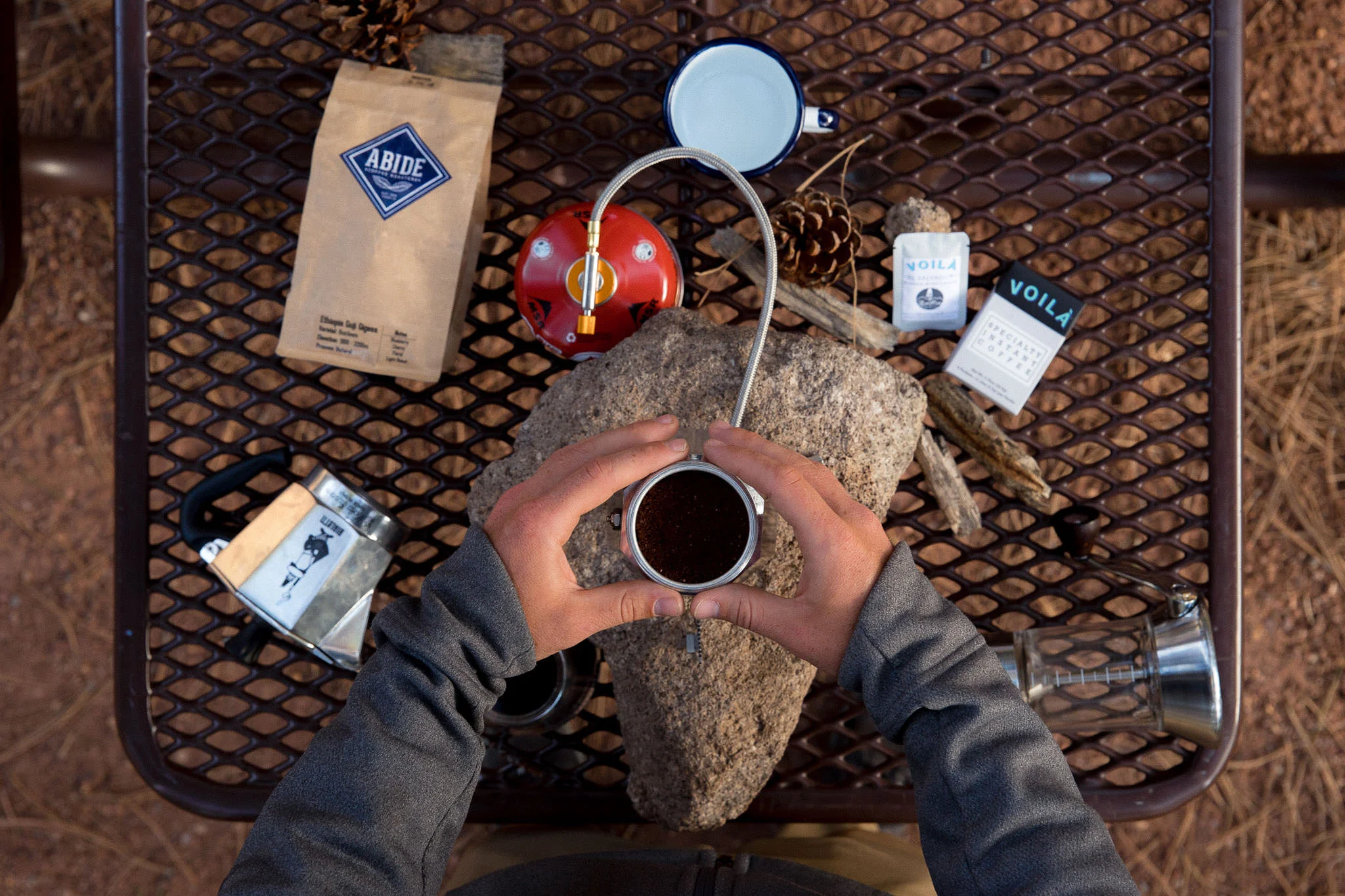 Brewing coffee with a moka pot while camping