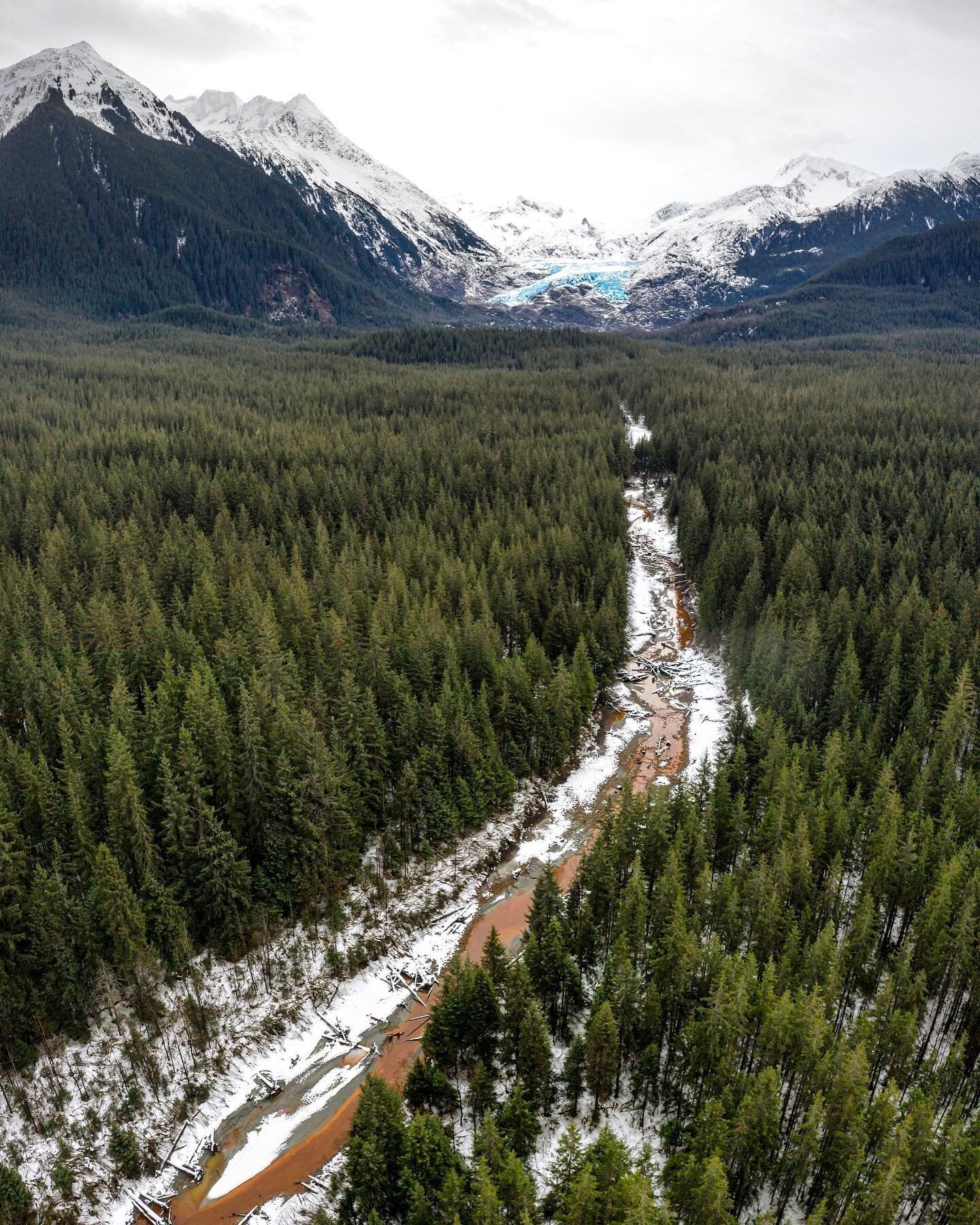 The blue hues of Herbert glacier radiate on a grey day.