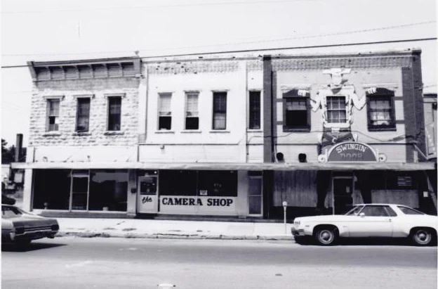 This is what the corner of Dickson Street and West Avenue looked like a few years before the buildings were renovated.