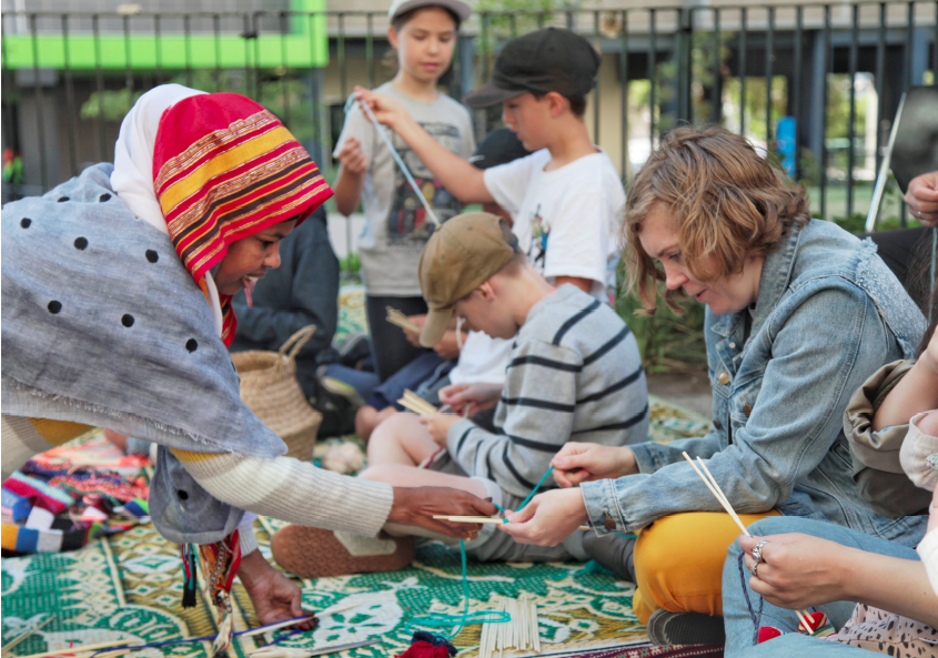 Children from local primary schools and members of the local neighborhood participated in weaving classes led by the Somali Community. Photo Credit:  Creative Gaze