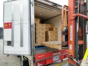 Hundreds of boxes being loaded for delivery to residents in locked-down housing estates