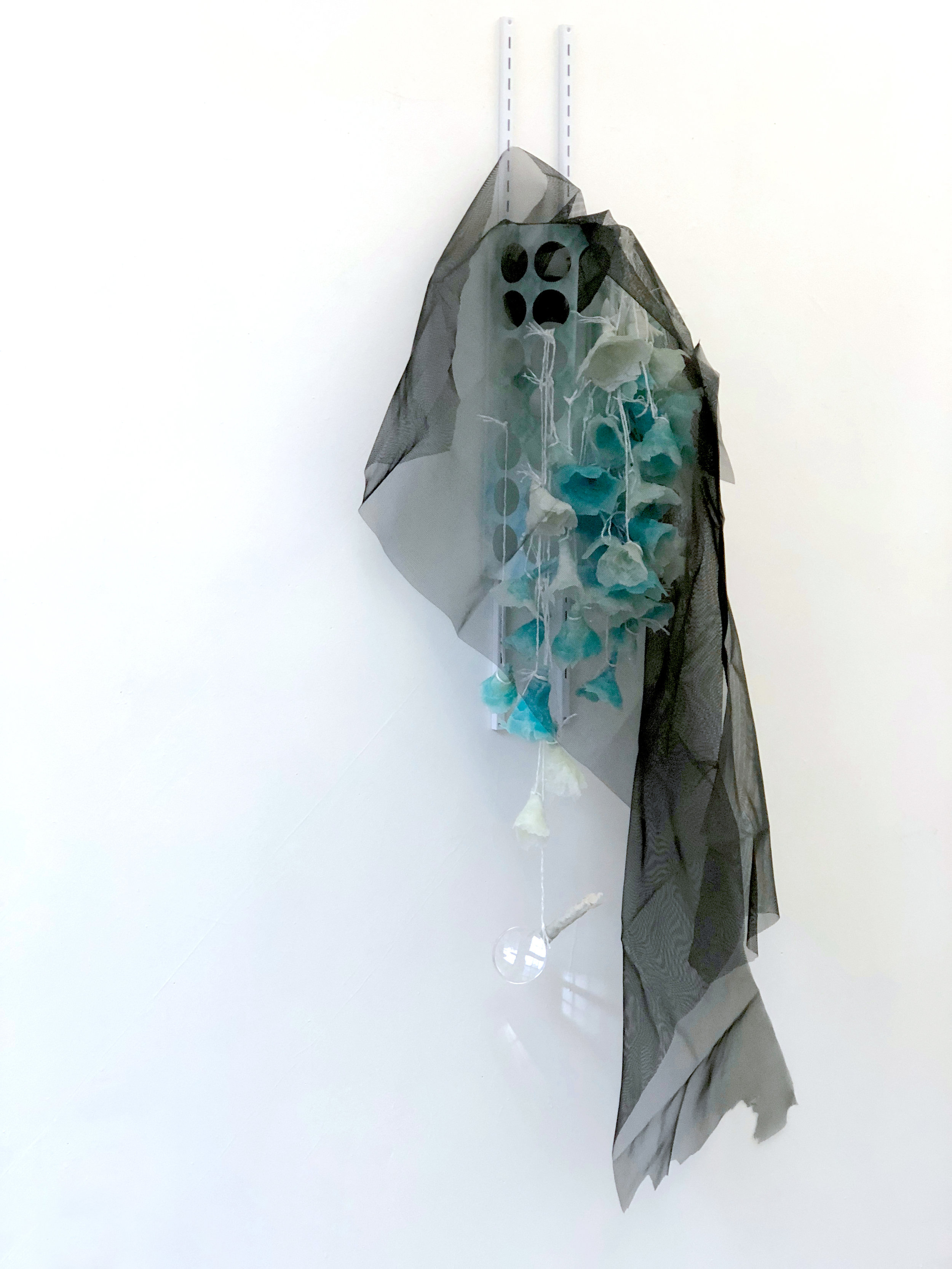    Shy Ghost  , 2018 Sheetrock joint compound gel, plastic bag dispense, wall bracket, polyester string, magnifying glass, charcoal fiberglass screen, lace, epoxy clay, acrylic and spray paint 67x30x17 inches    &nbsp;   