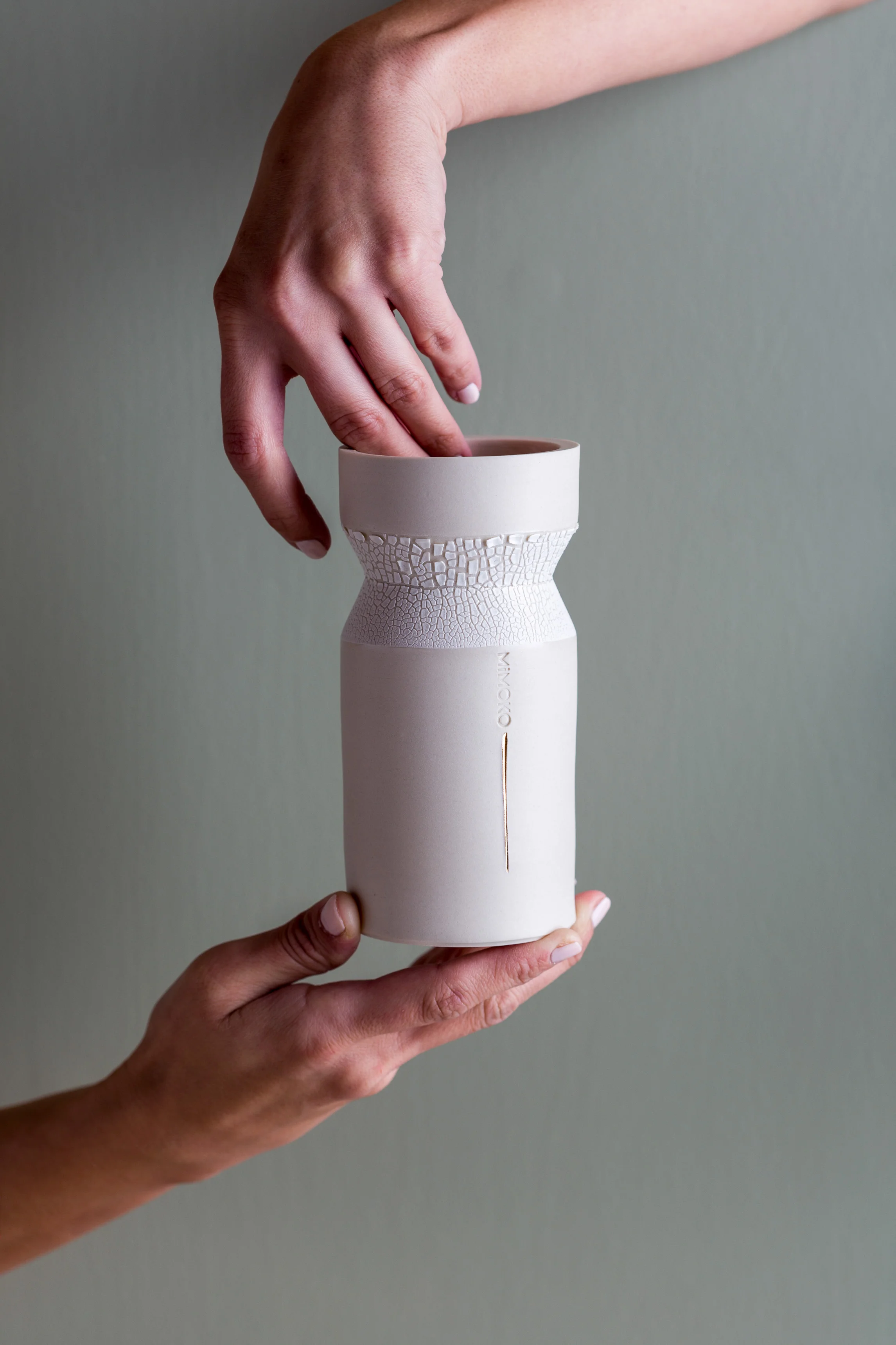 MiMOKO Ceramics | vase and hands