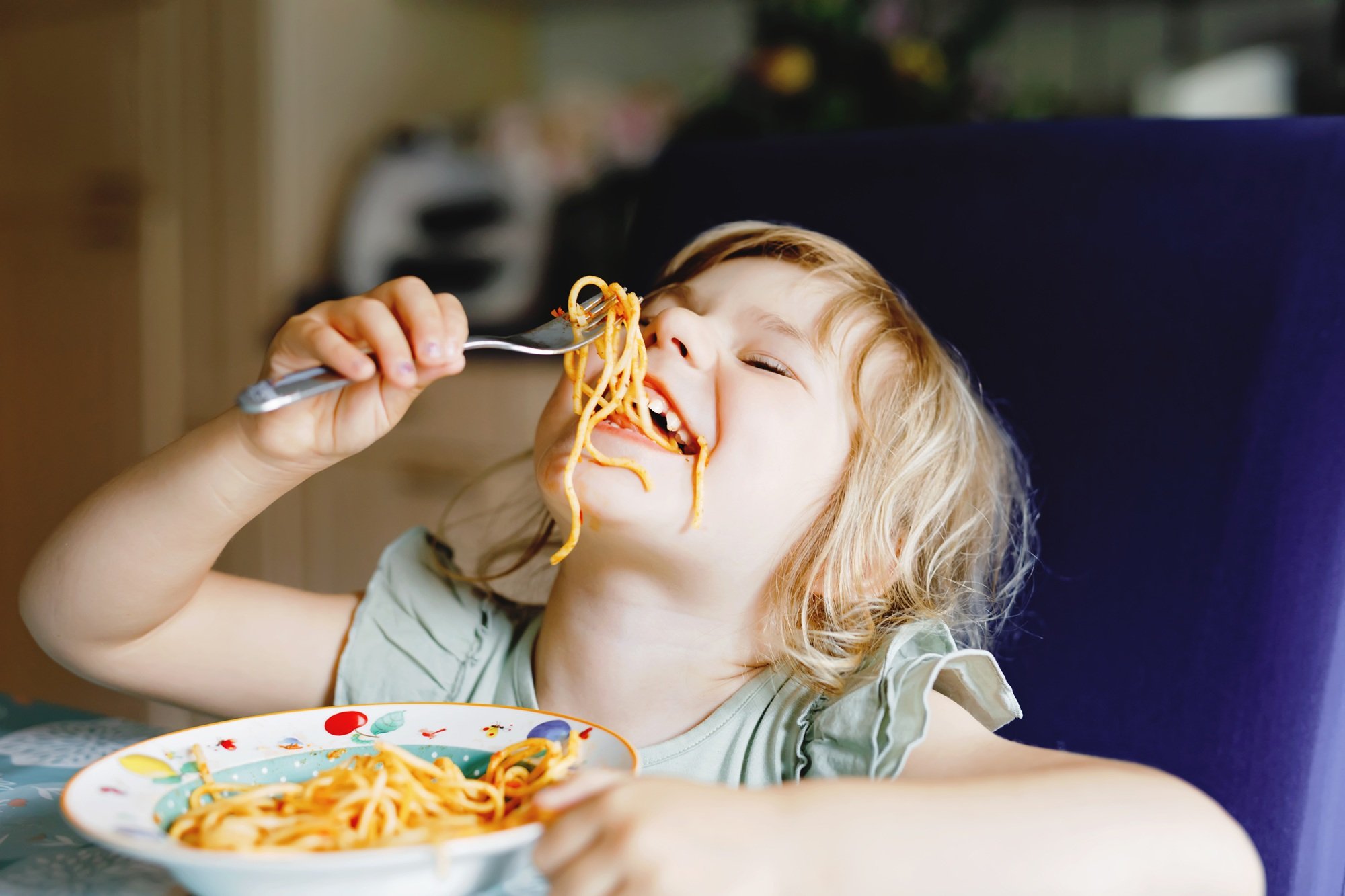 Kid_Food_Eating_Spaghetti_iStock-1326610285.jpg
