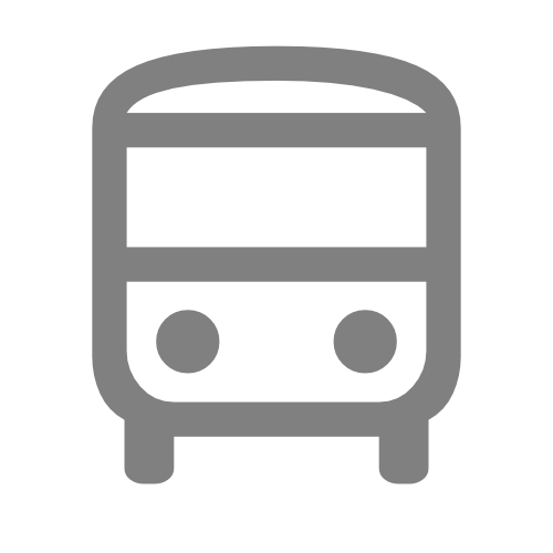 Icon of a city bus with two round headlights and rectangular front window.