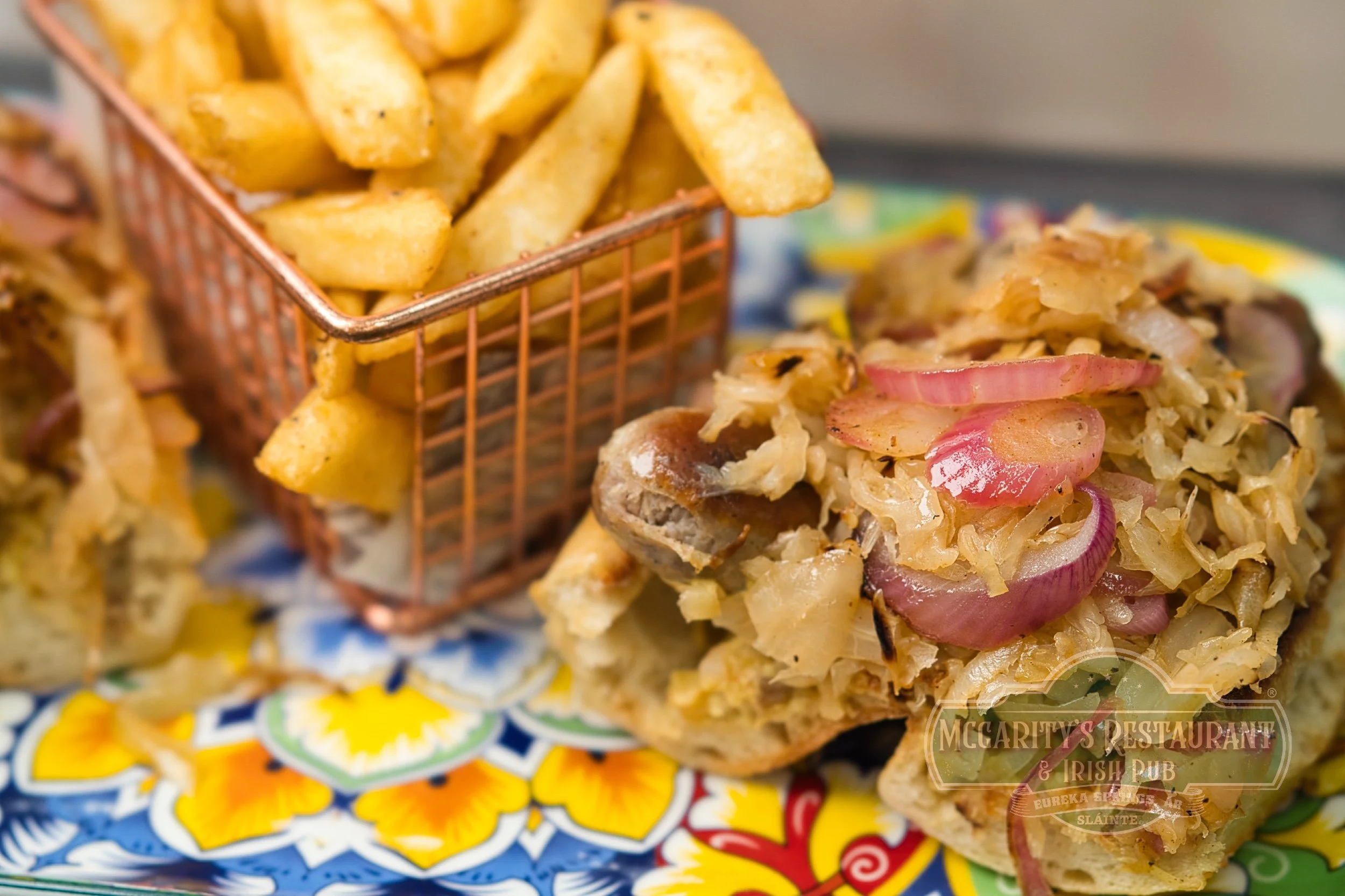 Irish Banger Sandwich with seasoned French fries at McGarity’s in Eureka Springs.