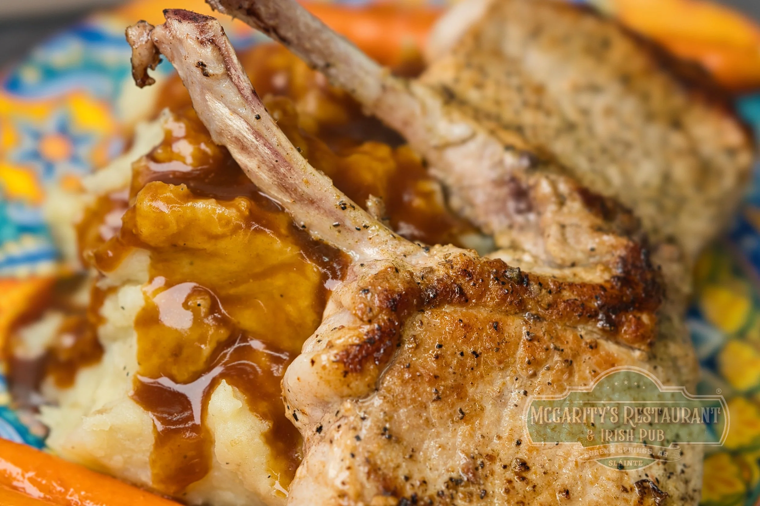 Pork Chop with mashed potatoes, gravy, and braised carrots at McGarity’s in Eureka Springs.