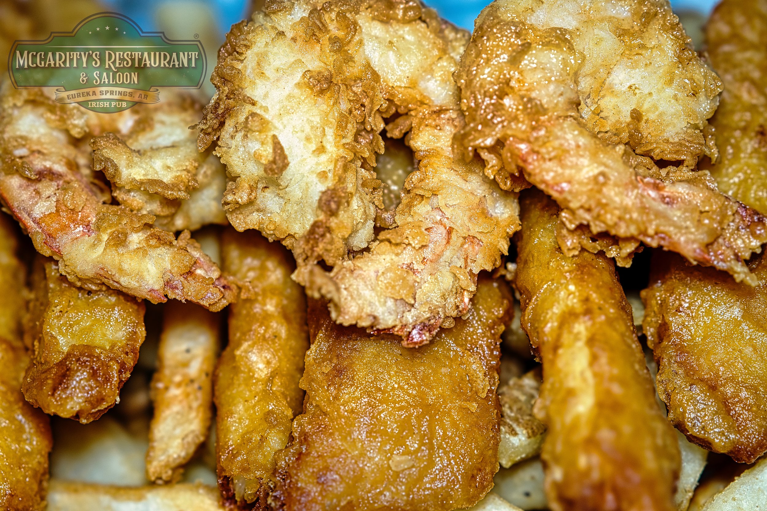 Close-up of fried fish fillets with a crispy golden coating.
