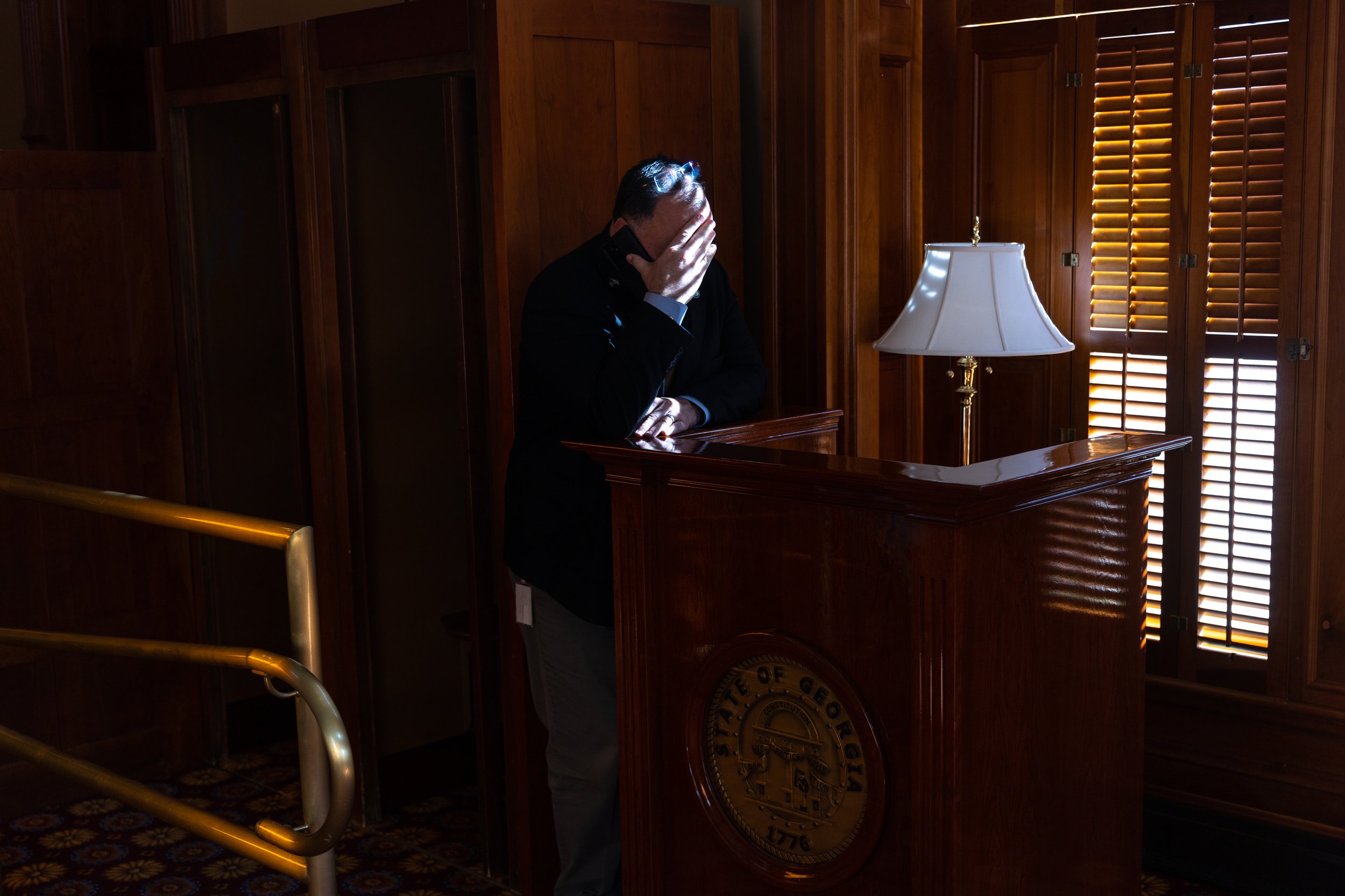  Georgia State Rep. Brent Cox, R-Dawsonville, speaks on the phone outside the House of Representatives in Atlanta on Sine Die, Wednesday, March 29, 2023. 