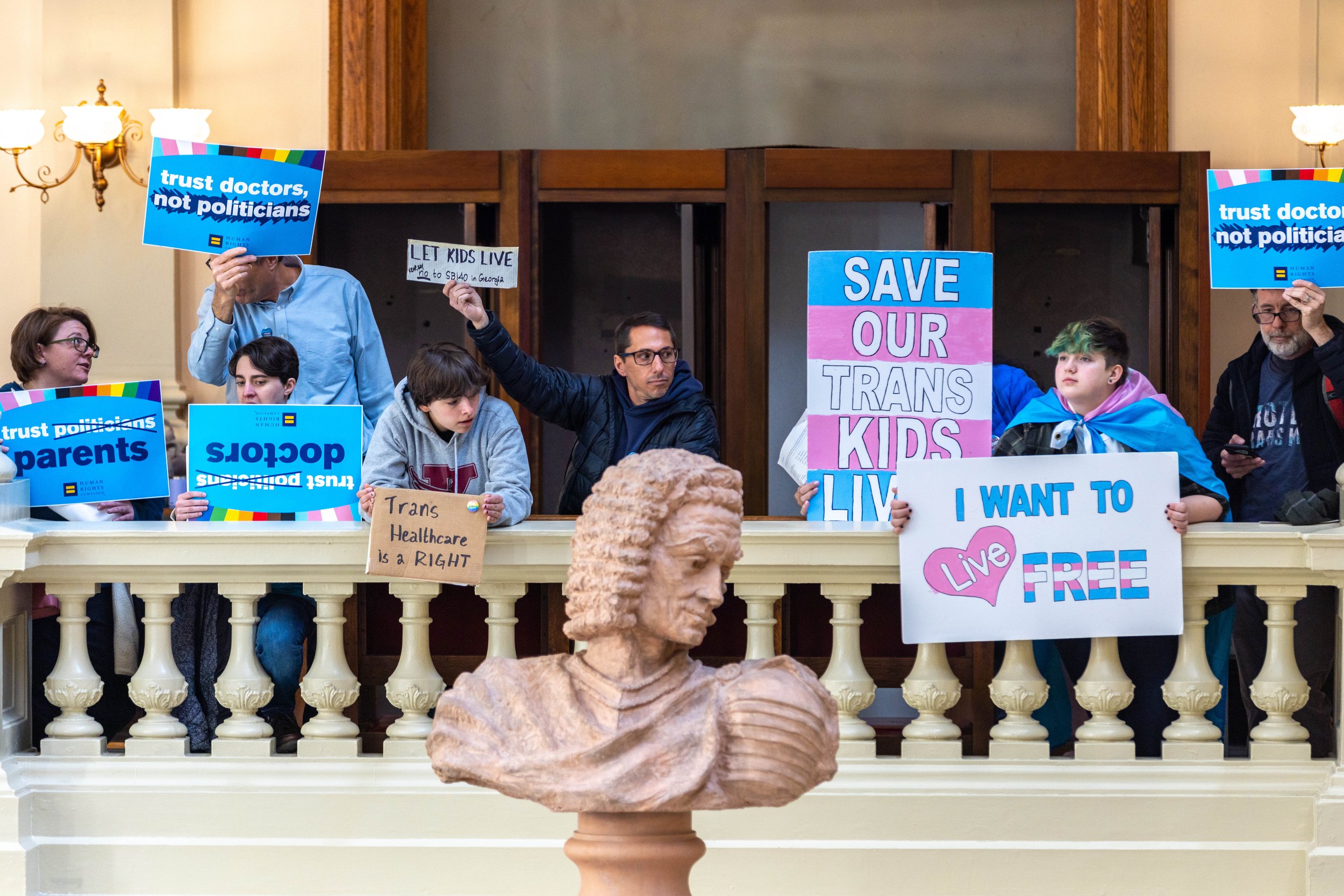  Opponents of SB 140, a bill that would prevent medical professionals from giving transgender children certain hormones or surgical treatment, gather in the Capitol in Atlanta on Monday, March 20, 2023. 