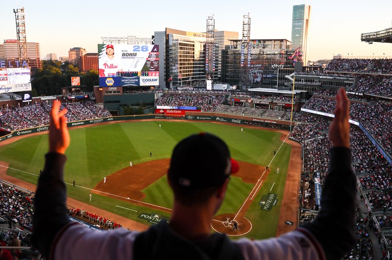  A fan cheers during Game 2 of the 2023 NLDS, Braves versus Phillies, at Truist Park in Atlanta on Monday, October 9, 2023. 