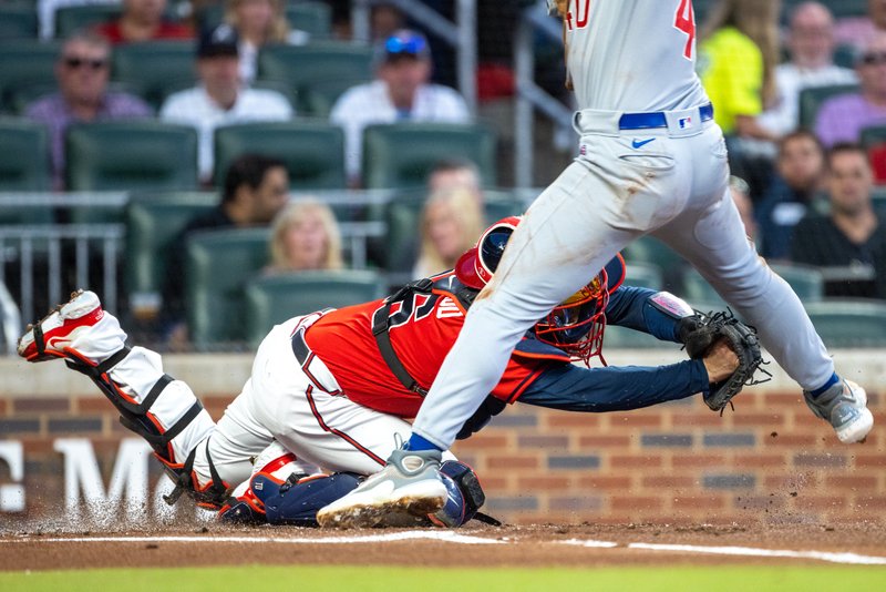  The Cubs’ Mike Tauchman (40) scores during the first inning of the Braves versus Cubs game at Truist Park, Tuesday, September 26, 2023, in Atlanta. 
